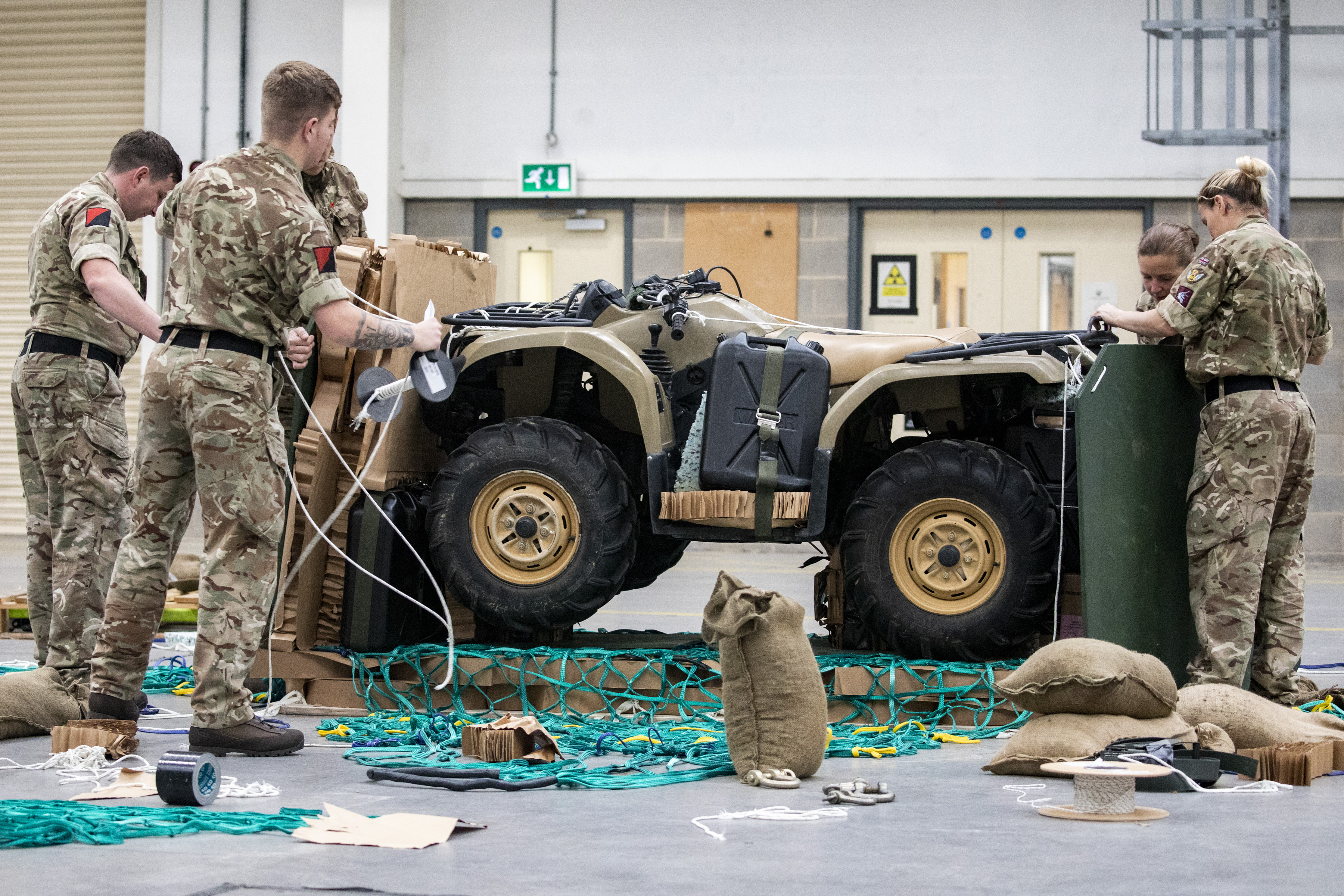 Image shows RAF aviators with a jeep vehicle.