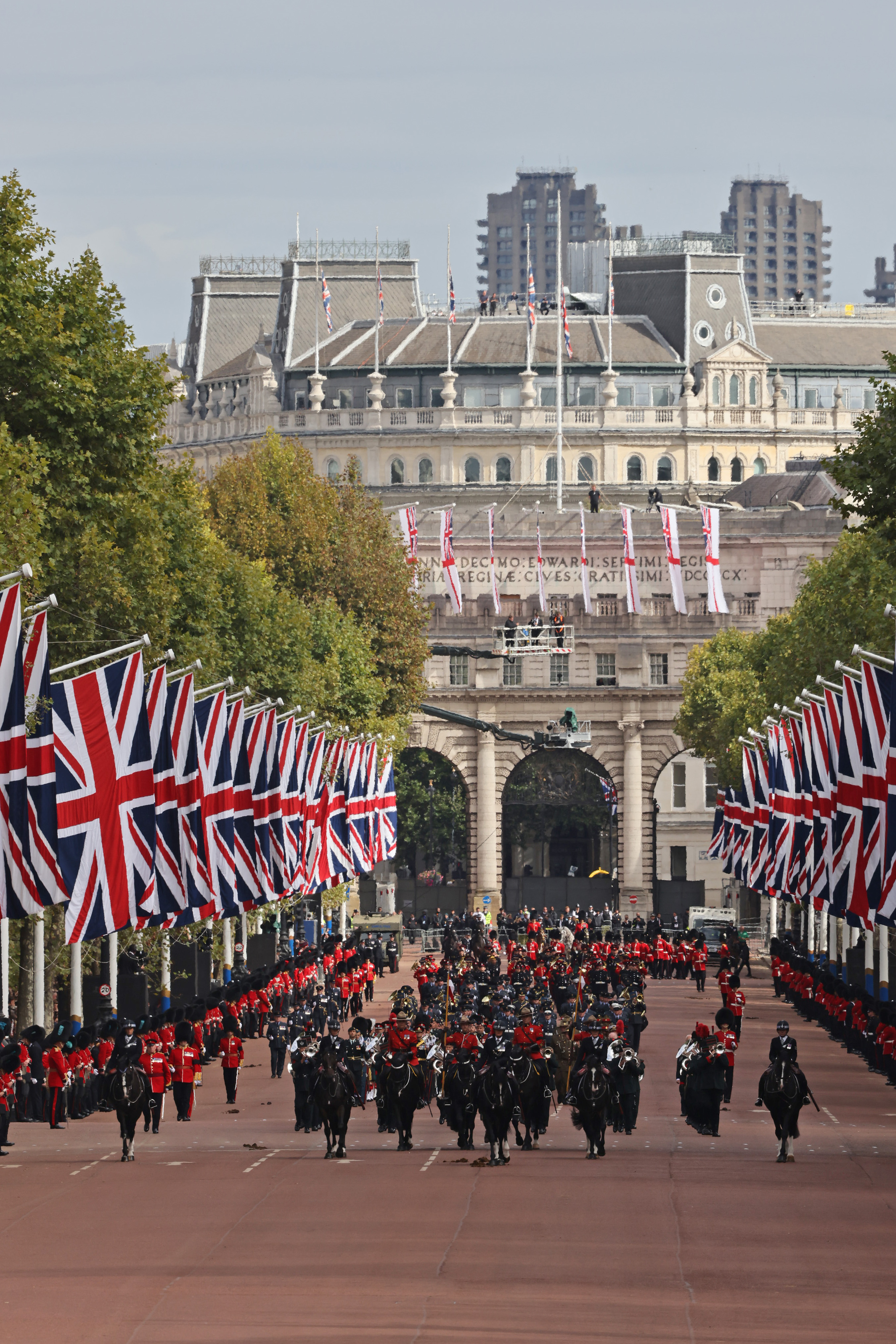 Image shows the Armed Forces on horseback as they parade towards Buckingham Palace.