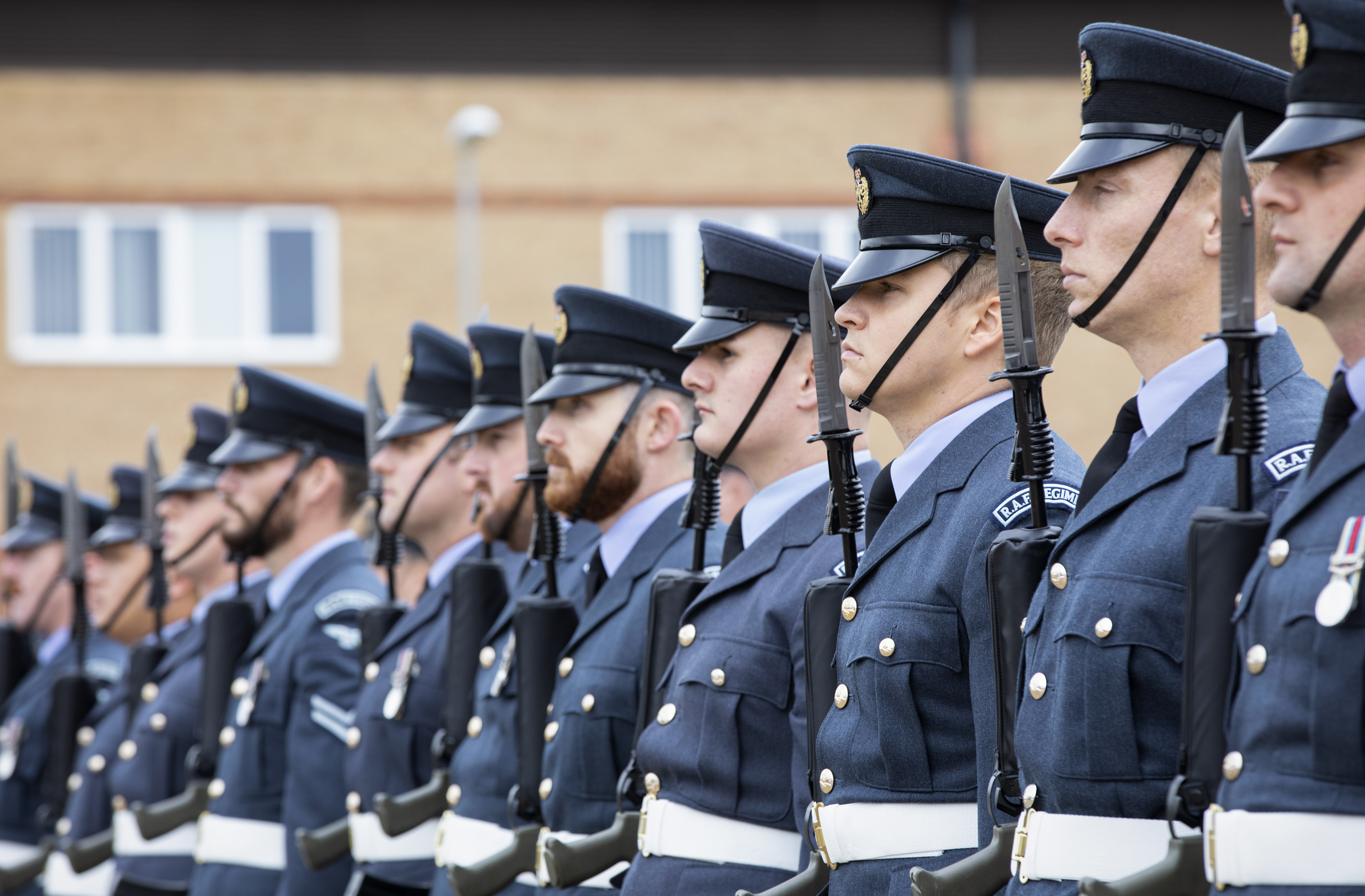 Personnel lined up on Parade with bayonet rifles.