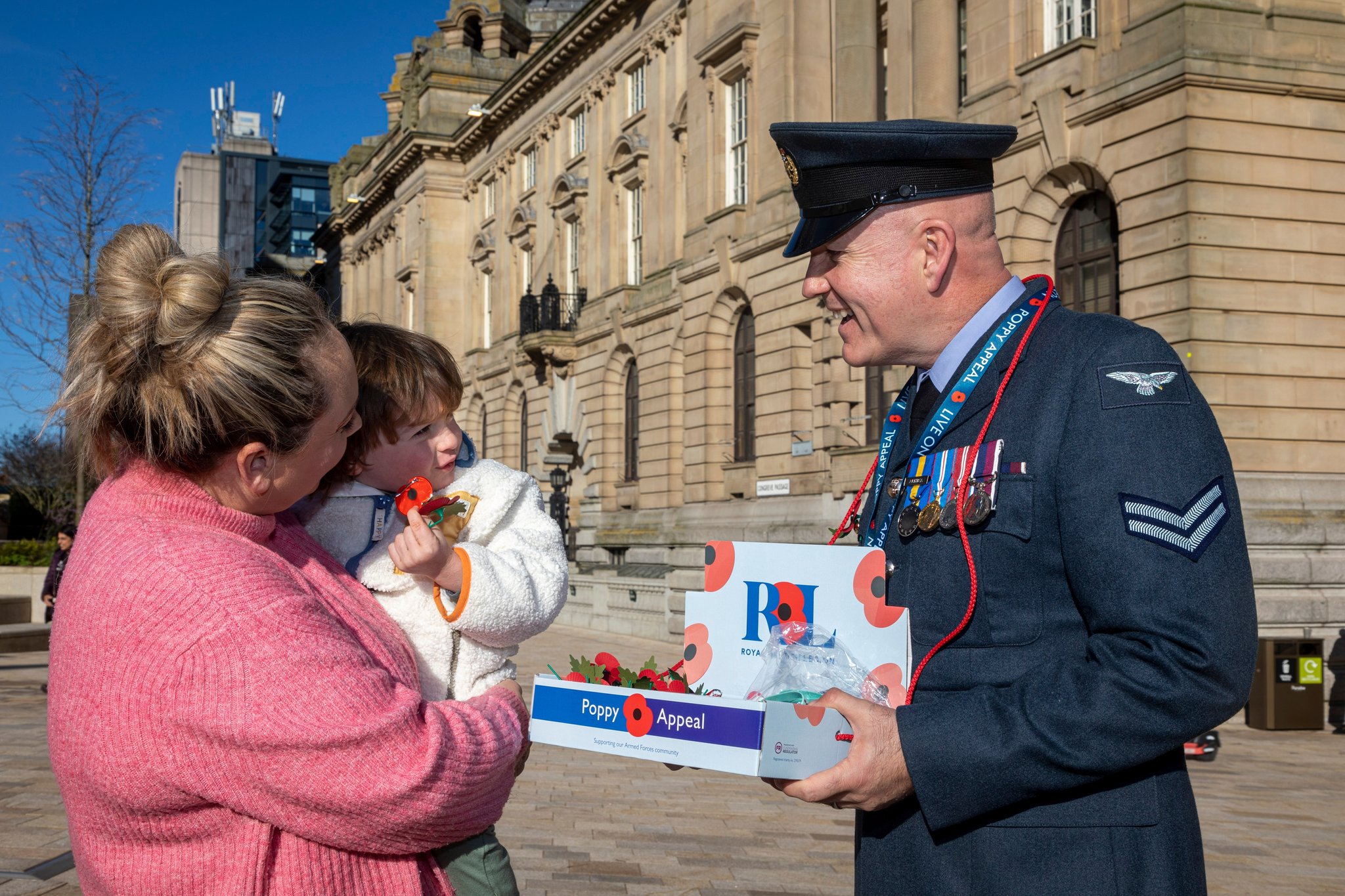 Personnel with Poppy bucket collections, while talking to public. 