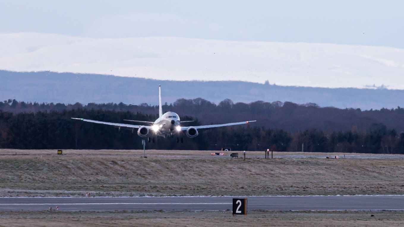 Image shows a RAF Poseidon aircraft taking off.