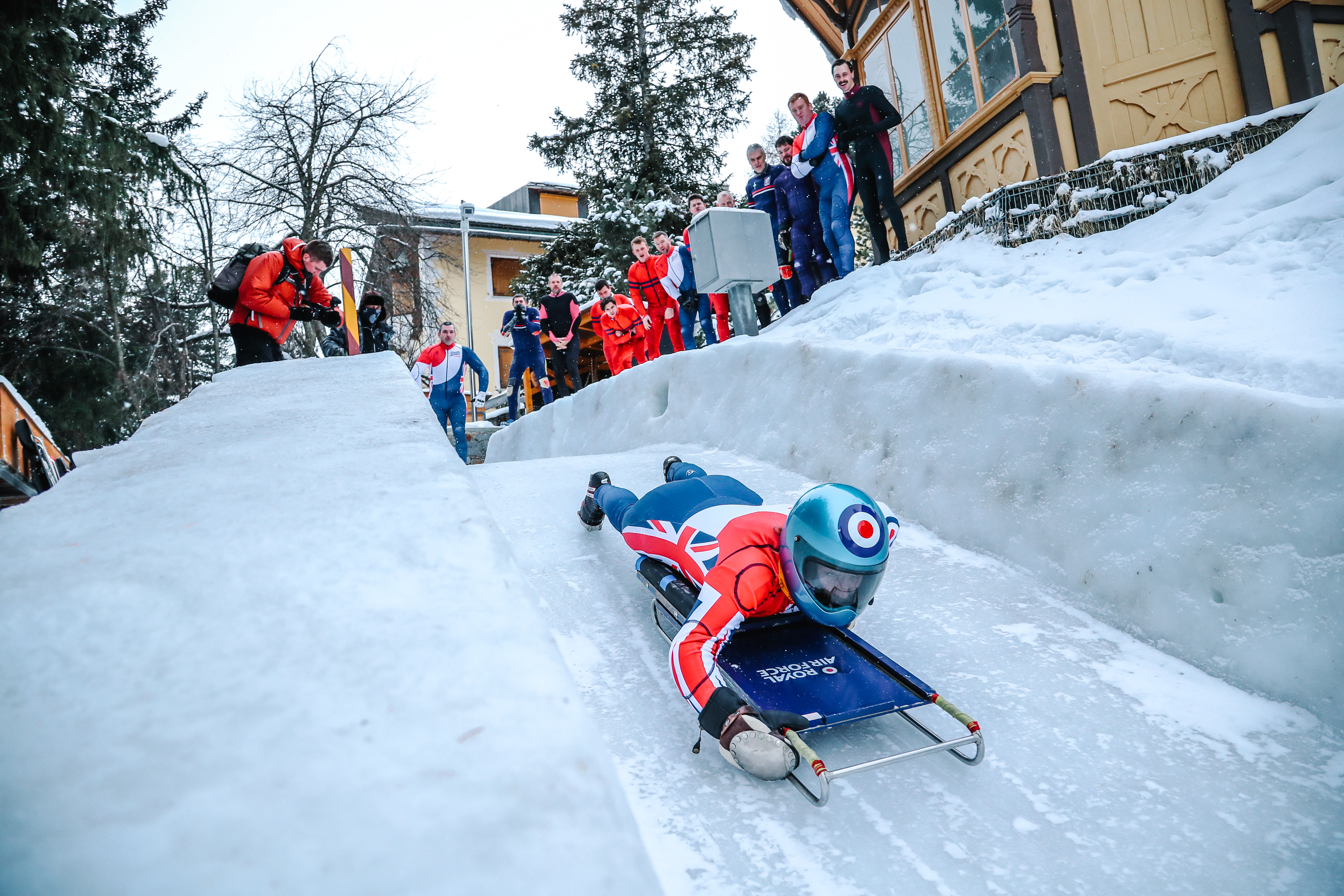 Image shows RAF aviator using a skeleton on the snow course.