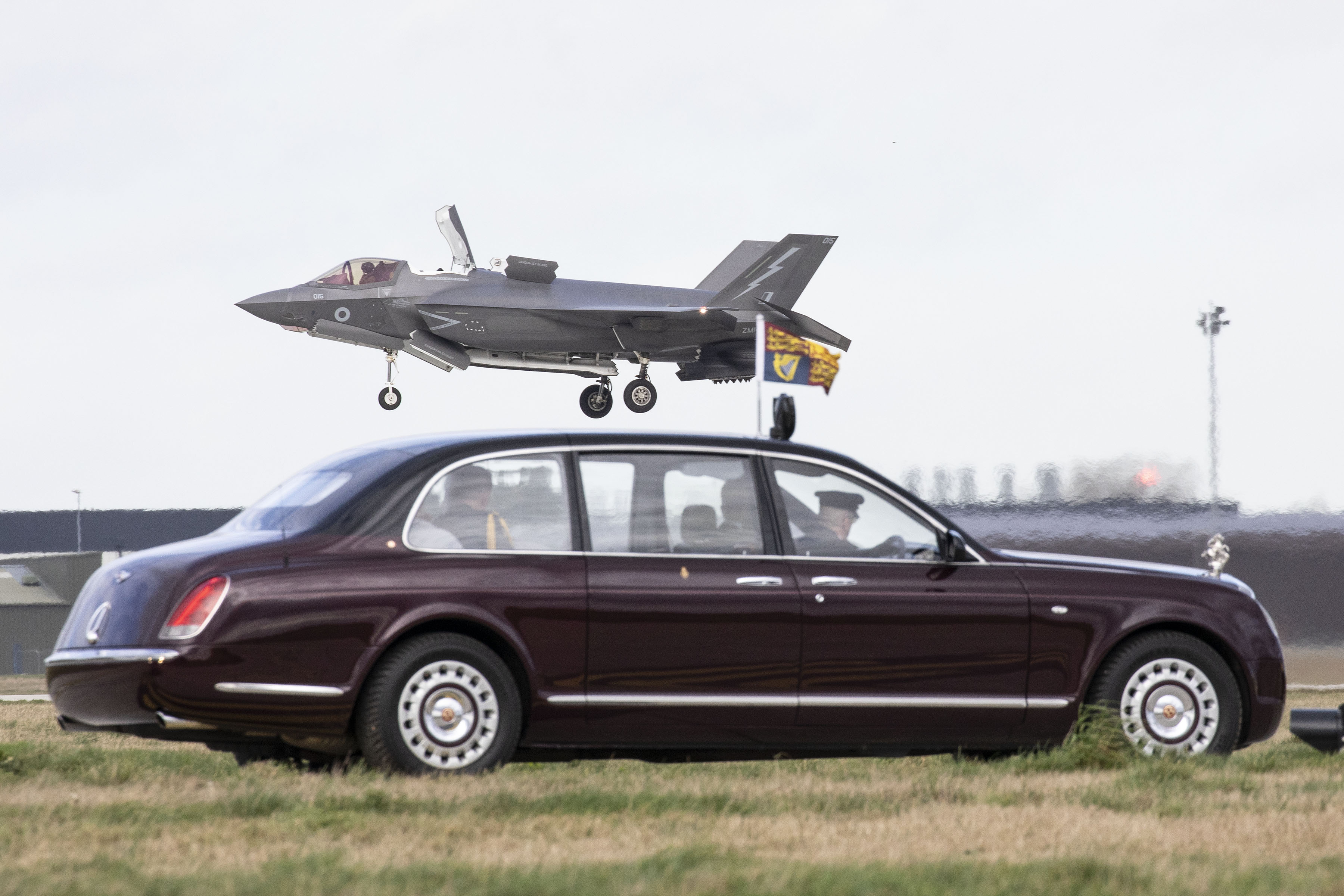Typhoon takes flight over car.