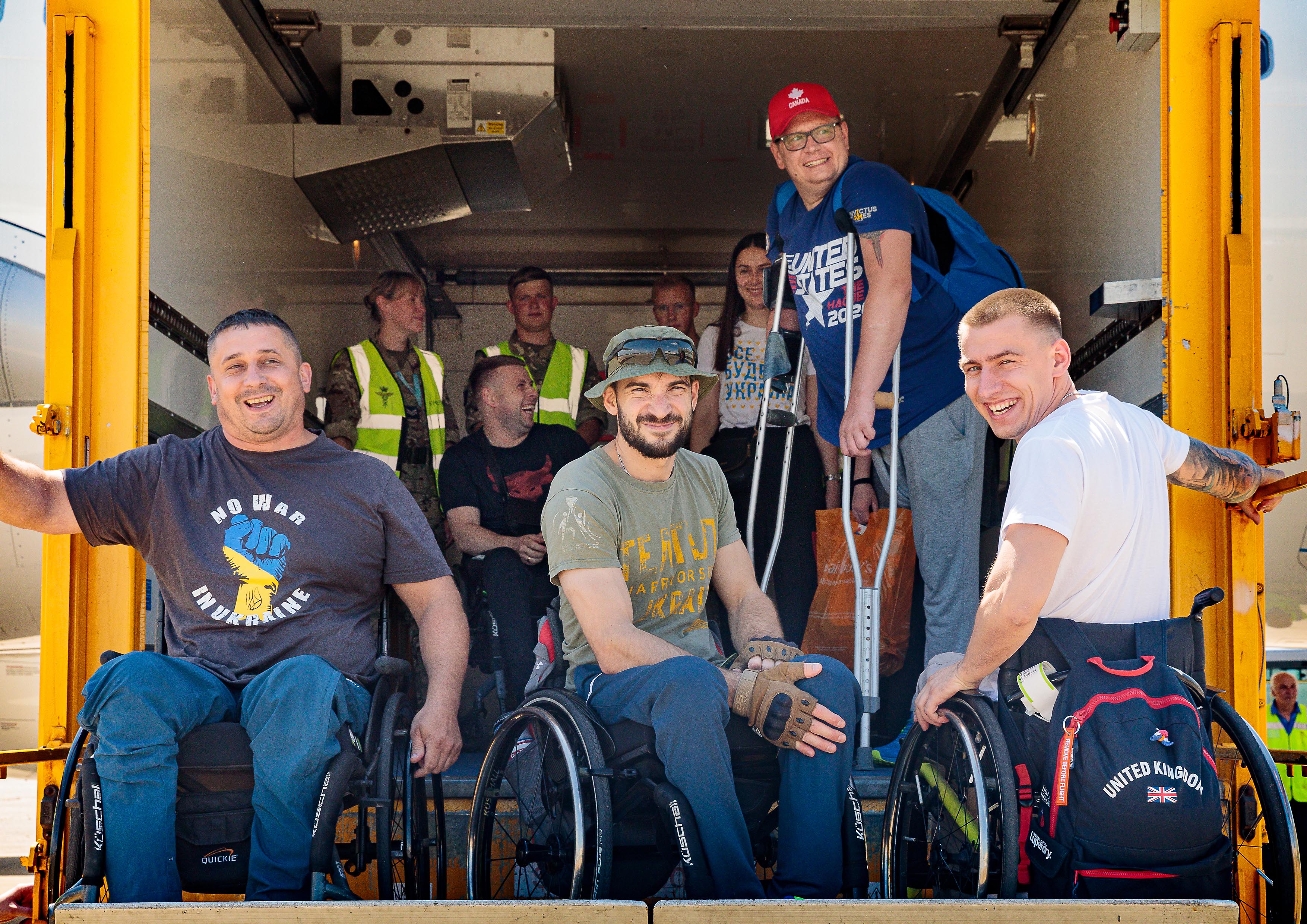 Image shows wheelchair users in the back of vehicle.