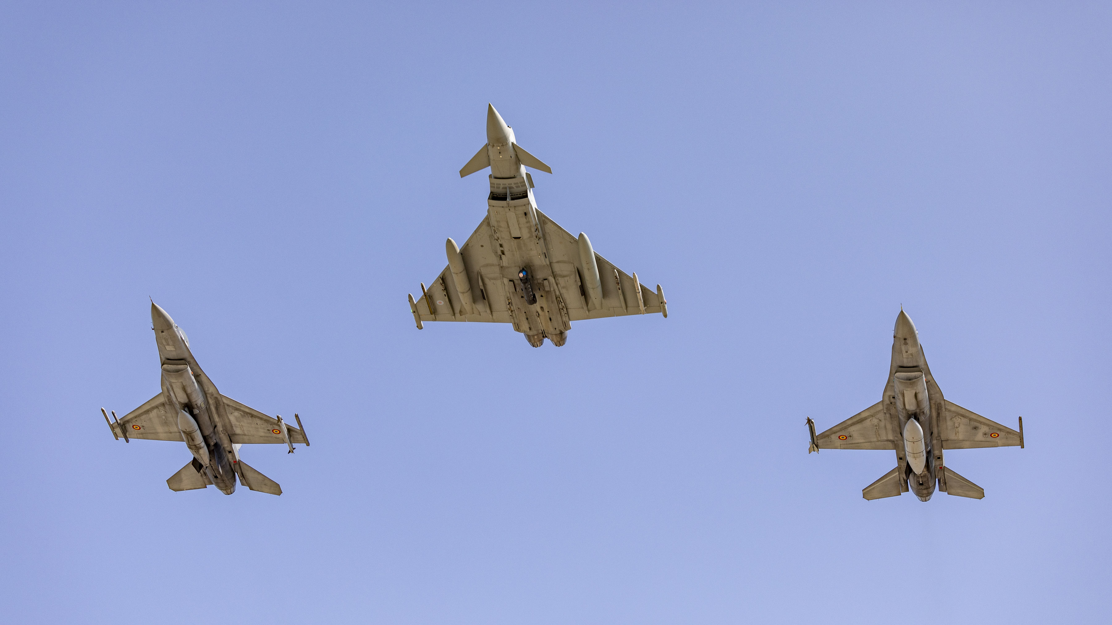 Image shows a Typhoon and Romanian aircraft in flight.