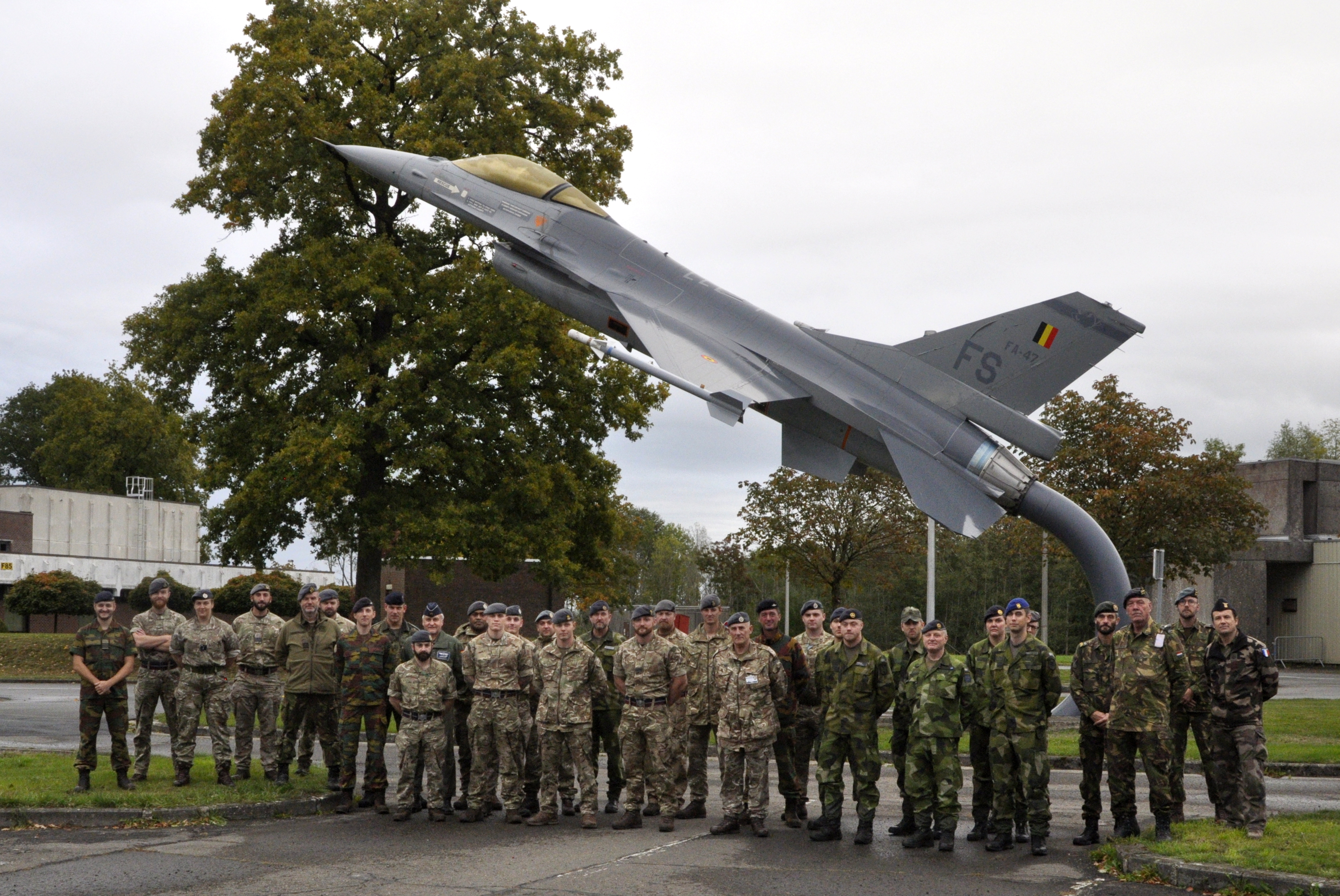 Image shows RAF Squadron outside by model of Typhoon aircraft.