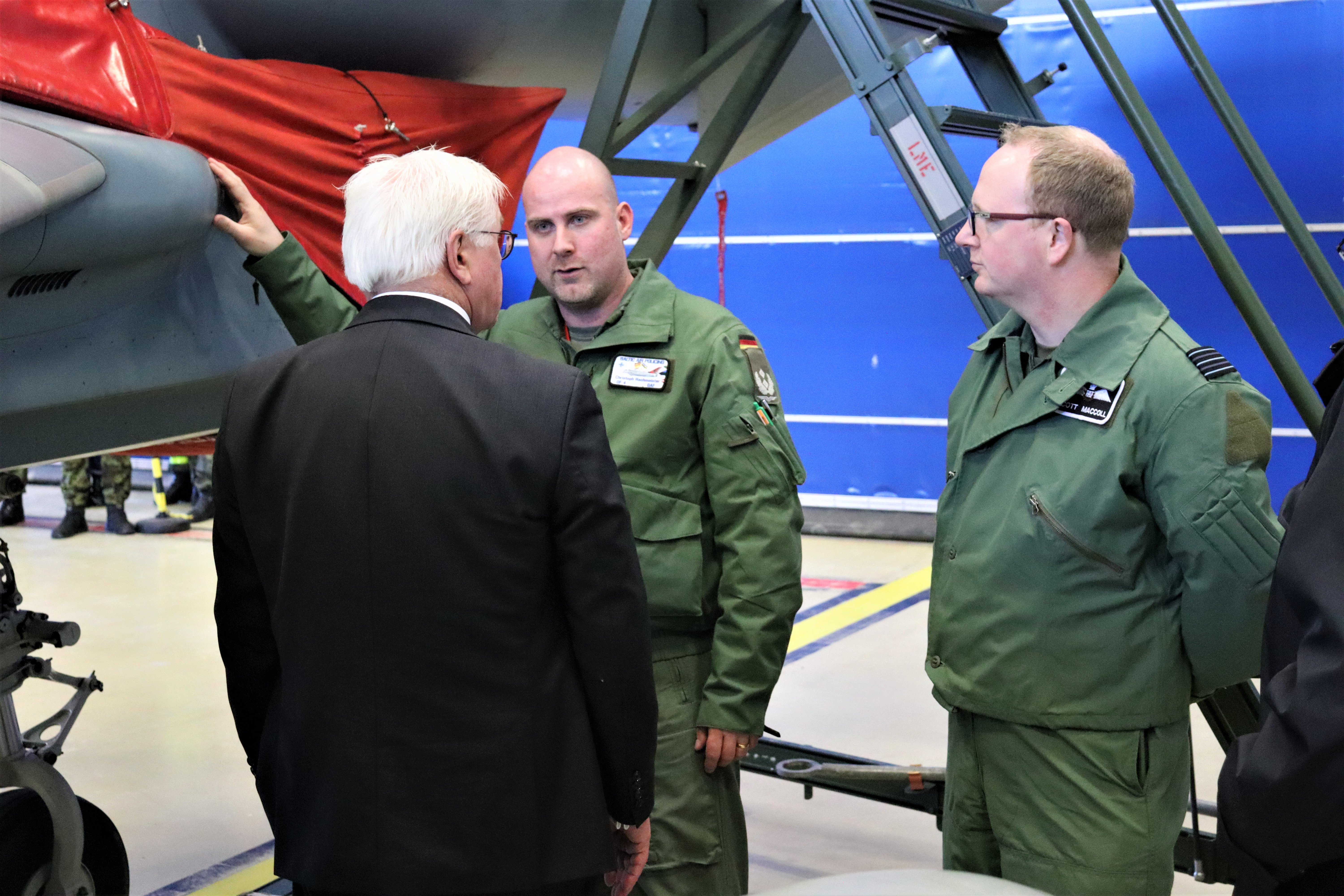 Image shows RAF standing with the German President by a Typhoon.