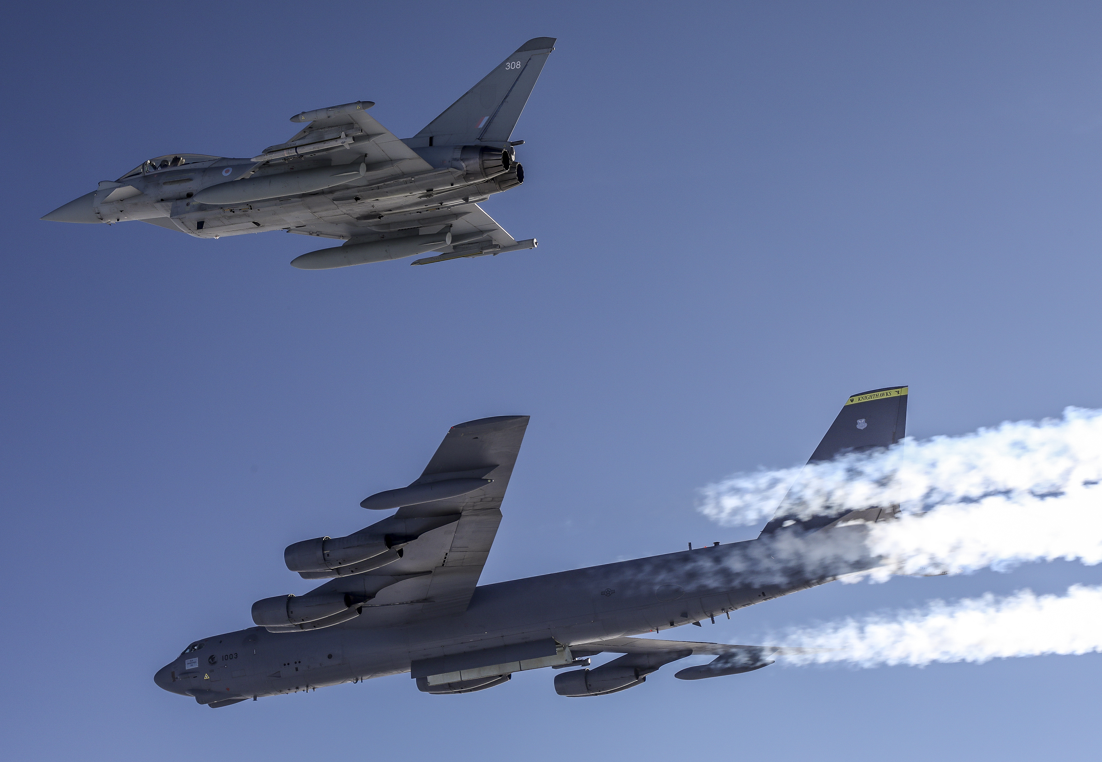 RAF Lightning jet in flight with US B-52.