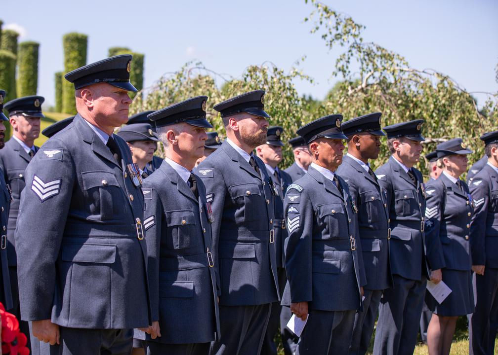 Aviators stand during service.