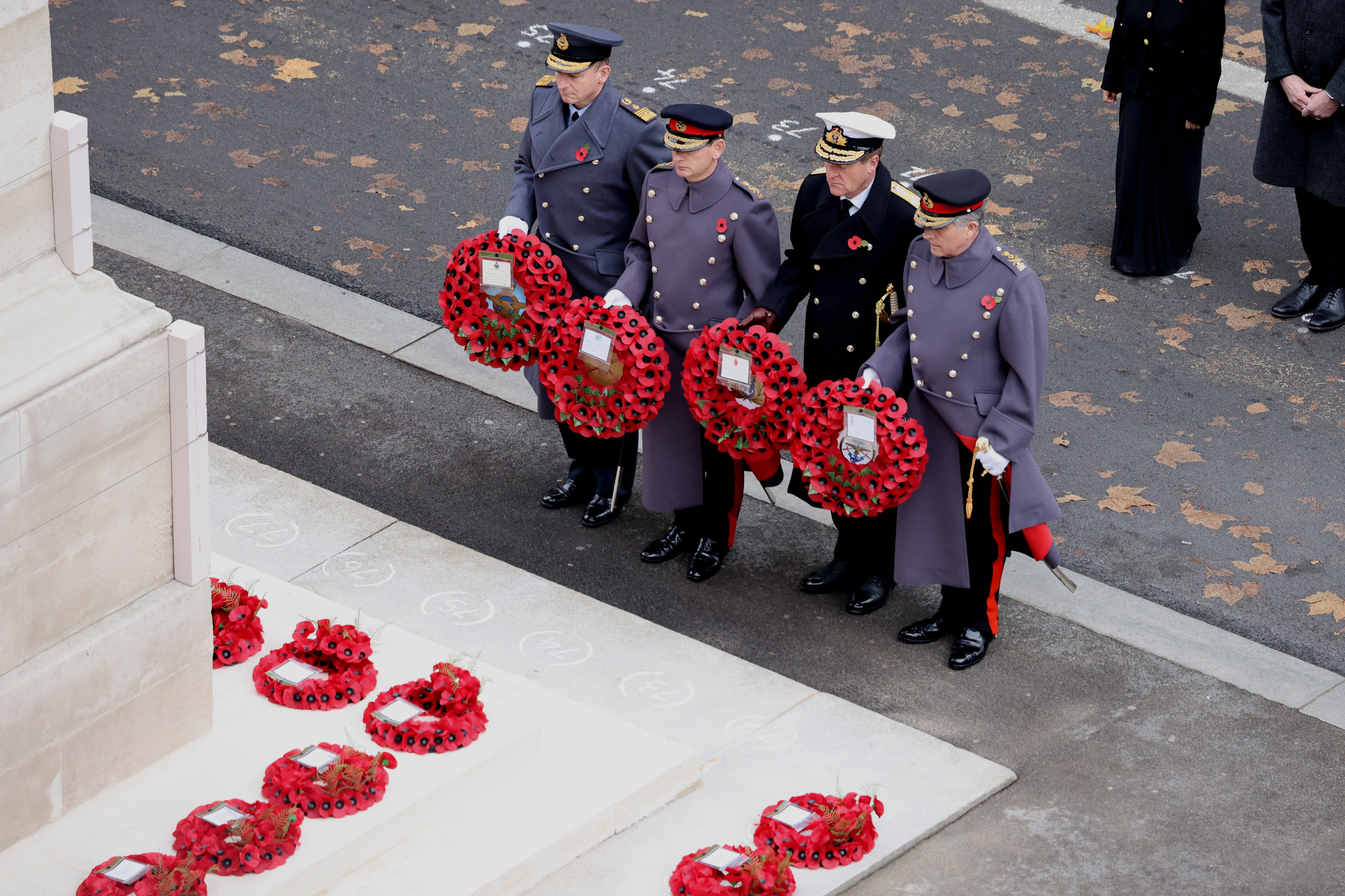 Personnel lay Poppy Wreaths at the Cenotaph.