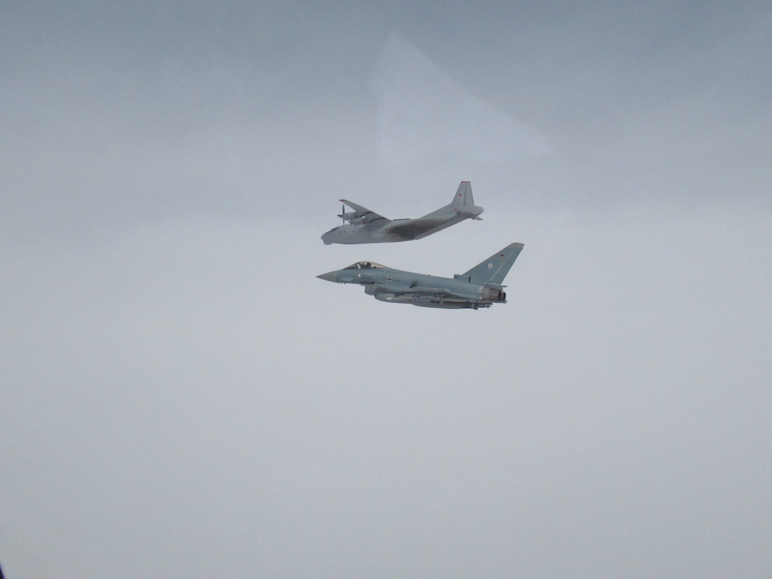 Image shows RAF boeing aircraft and Typhoon in flight.