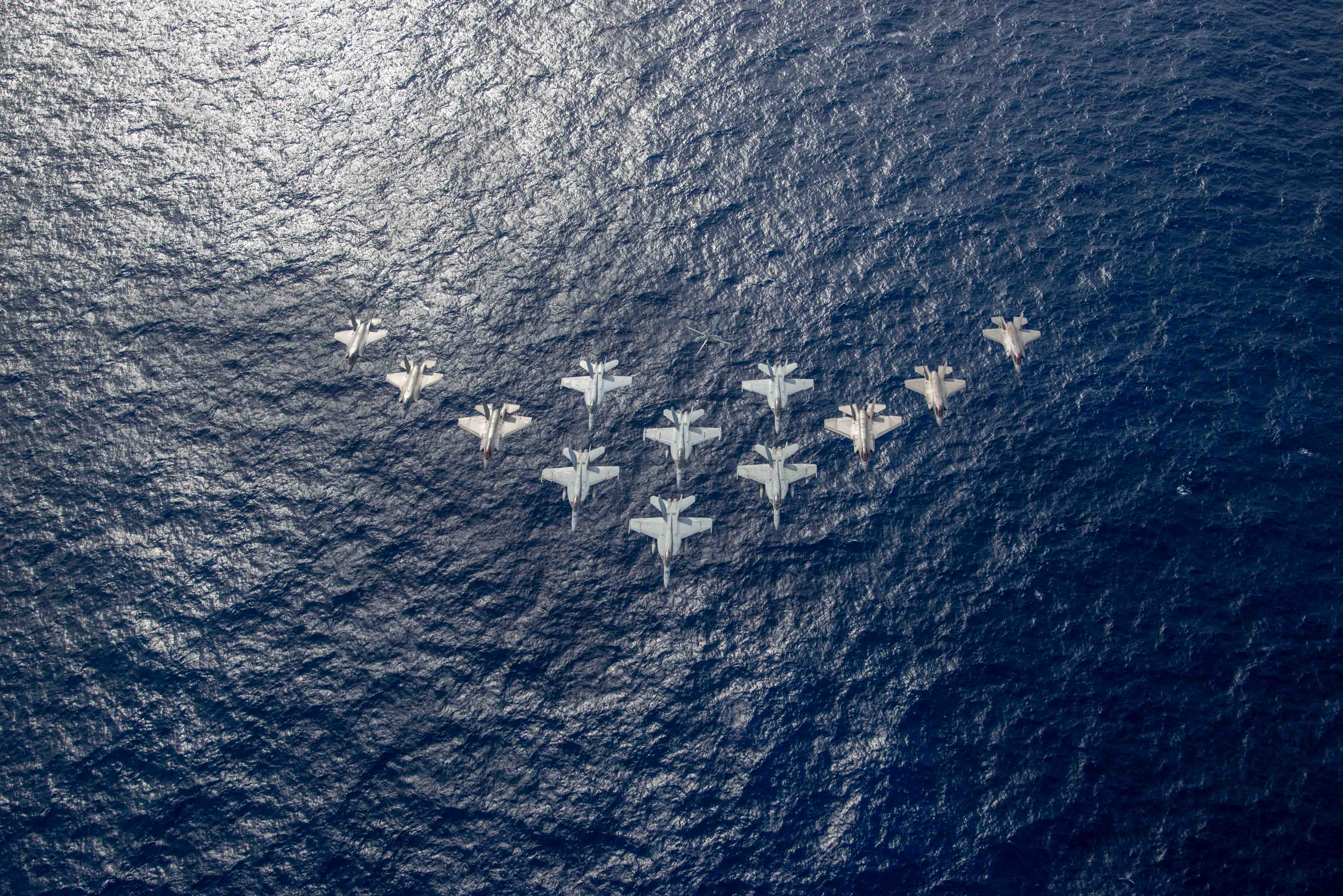 Two F-35B Lightnings fly in formation.