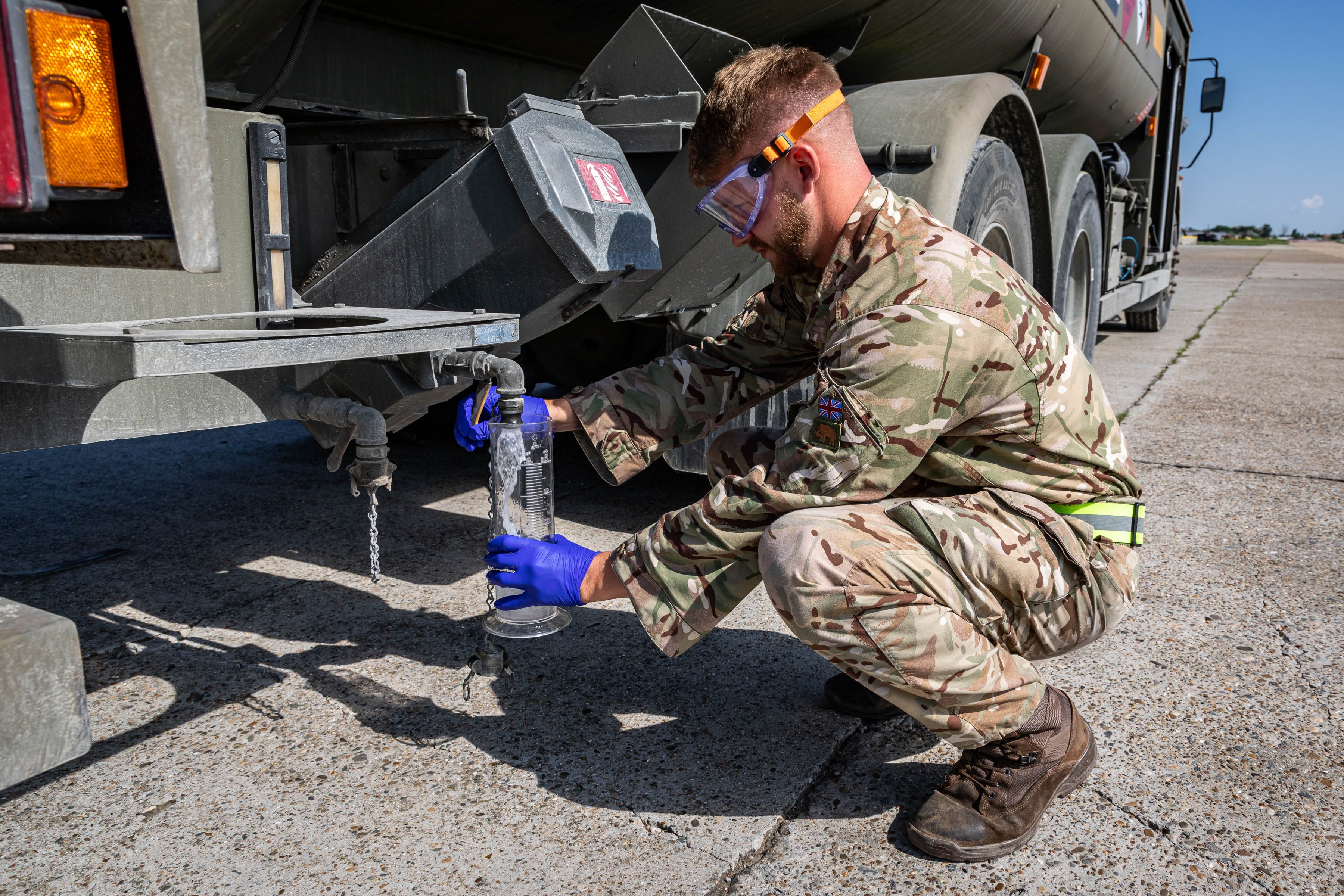 SAC Burns of 2MT Sqn checking the clarity of aviation fuel