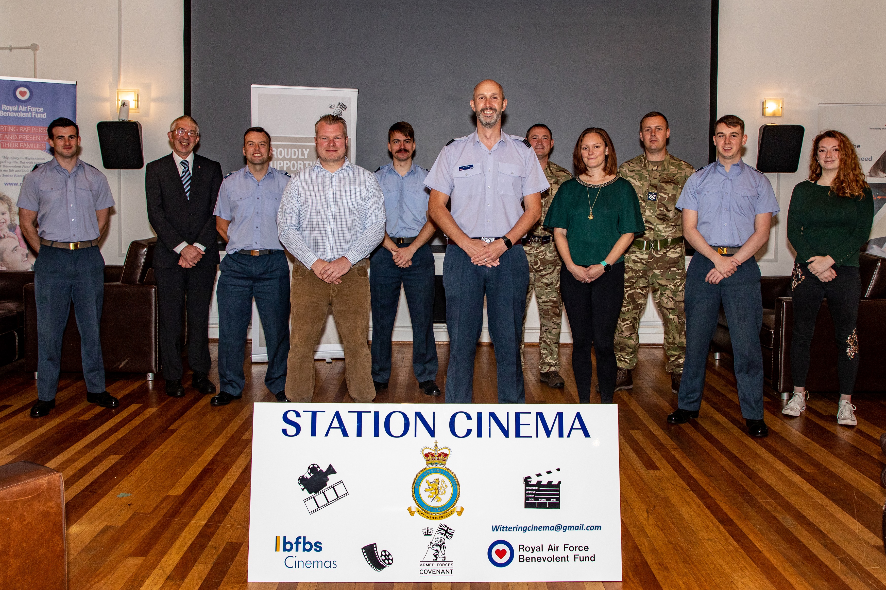 Mark Davis MBE, Thomas Kelly and Wing Commander Jez Case with the RAF Wittering Station Cinema Team