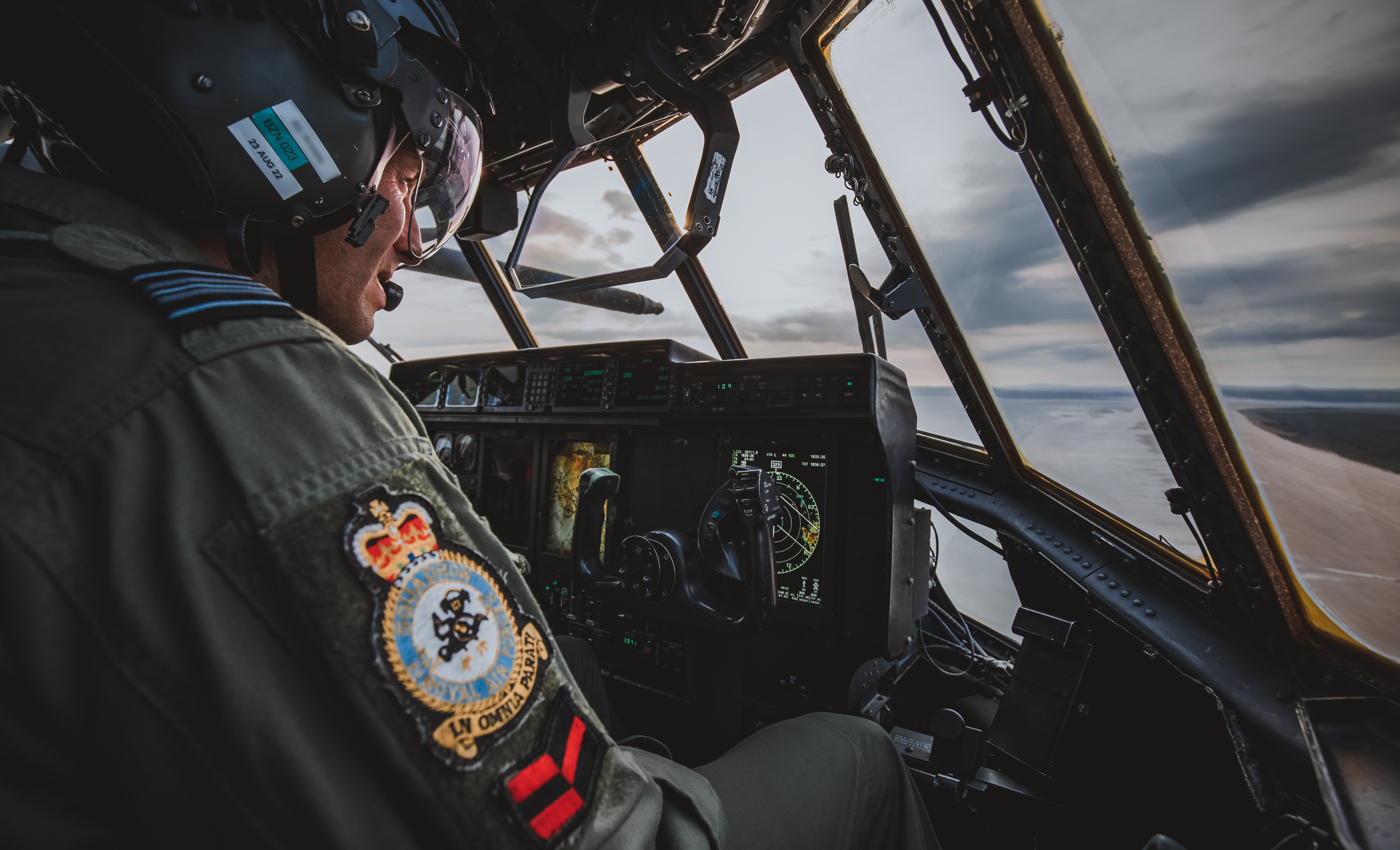 Image shows RAF aviator in the cockpit of the Hercules aircraft.