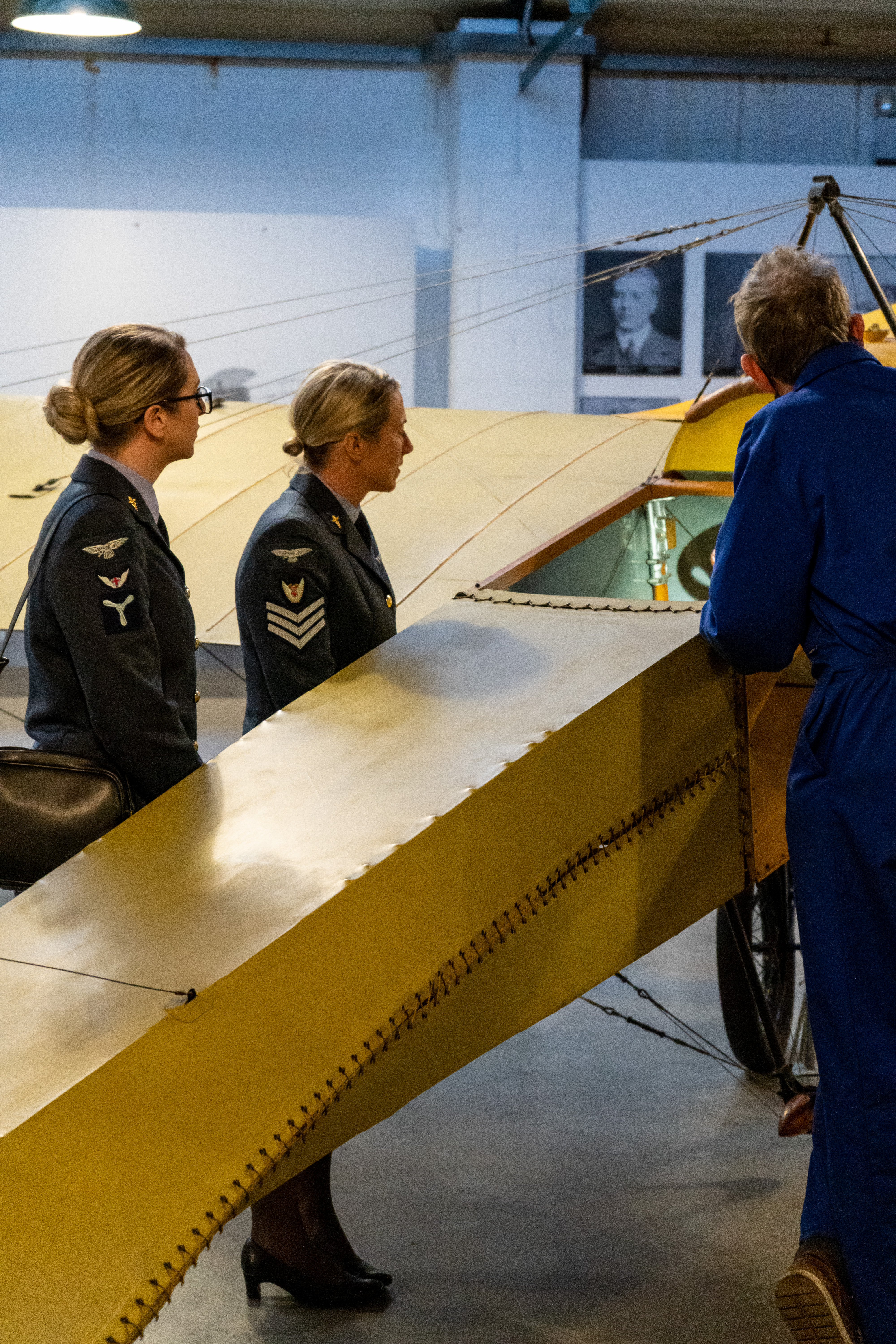 Personnel look at aircraft model. 