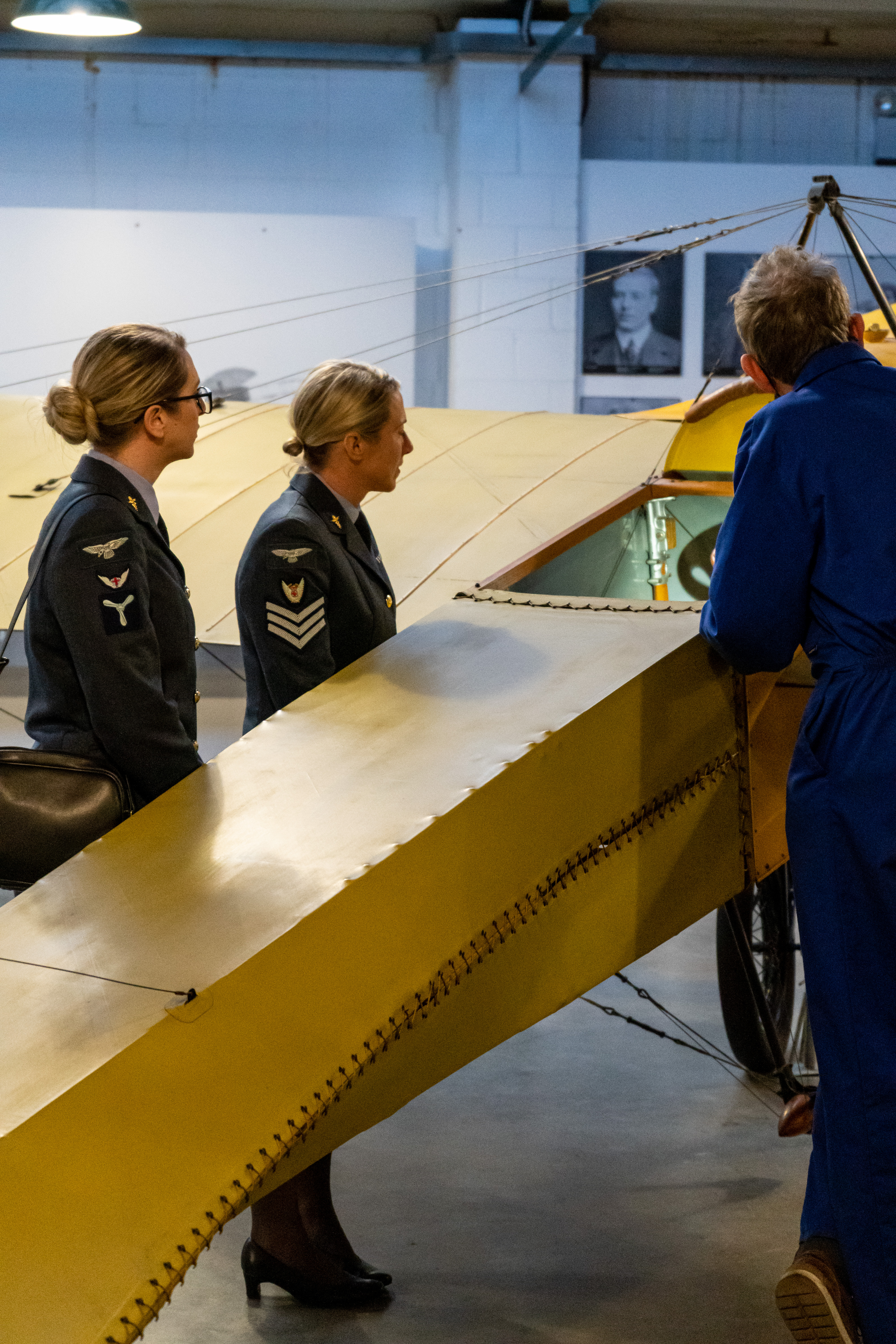 Personnel look at aircraft model.
