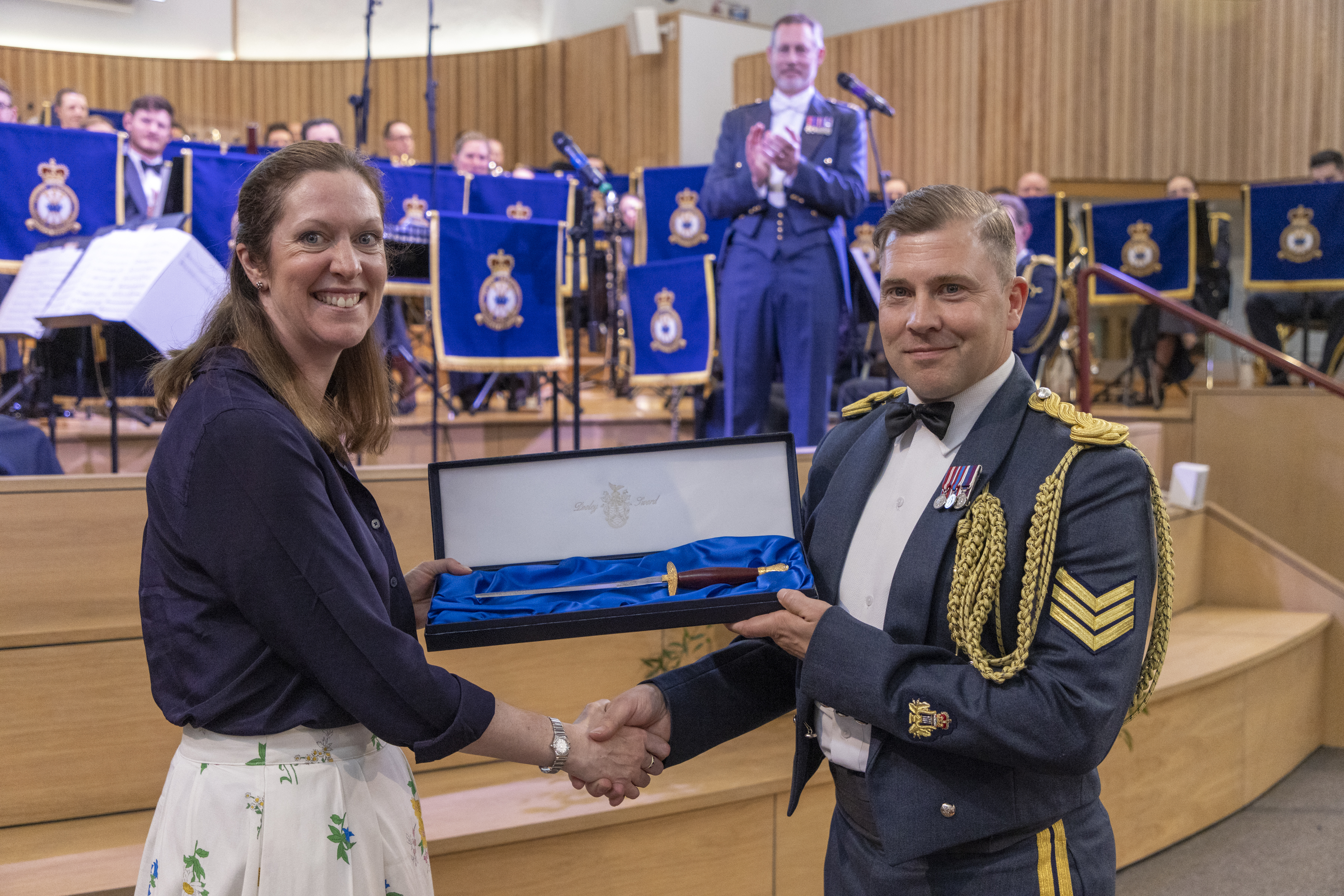 Group Captain Toria McPhaden presenting the Pooley Sword Composition Award to Sergeant Neil Wharton