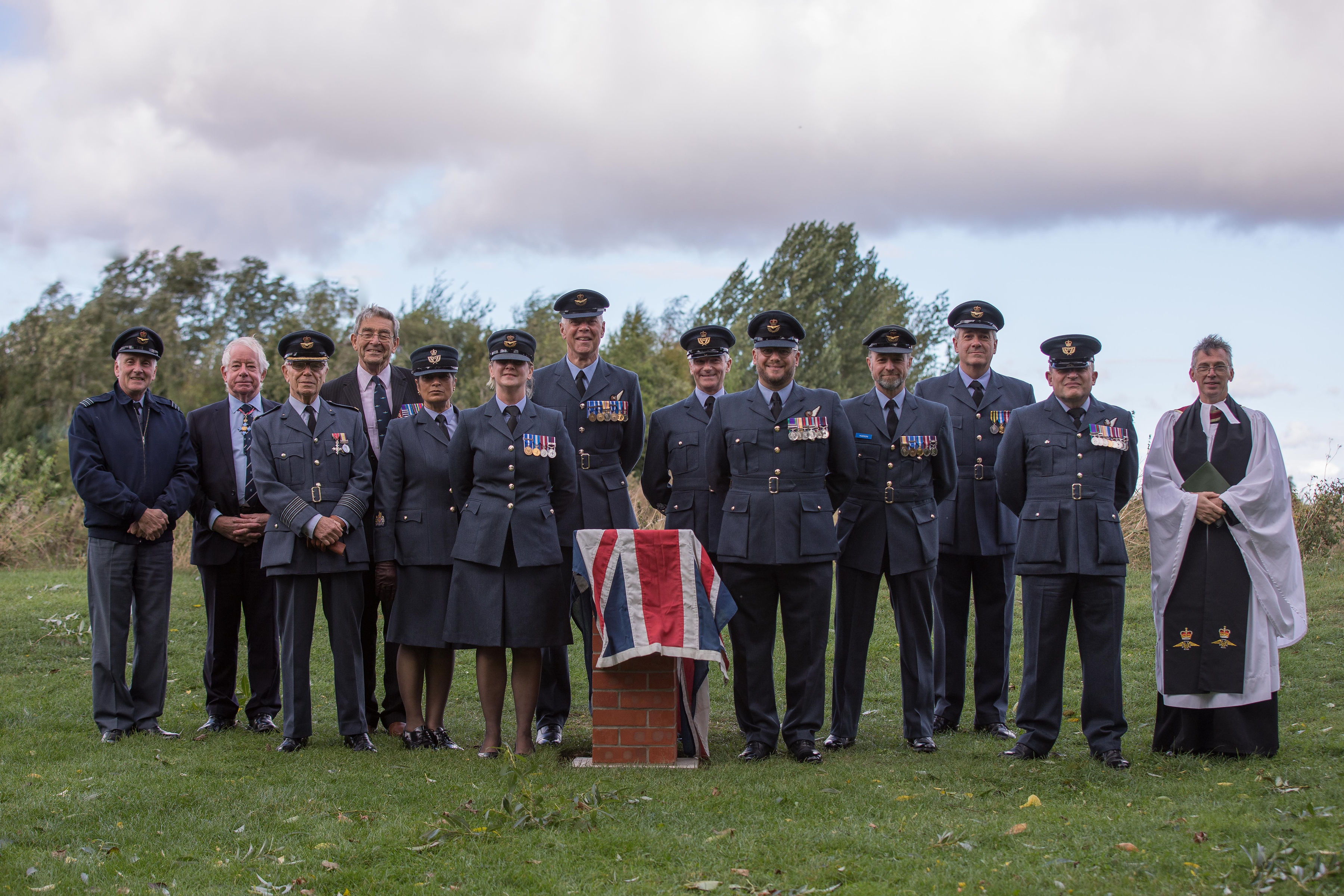 Personnel stand by the memorial.