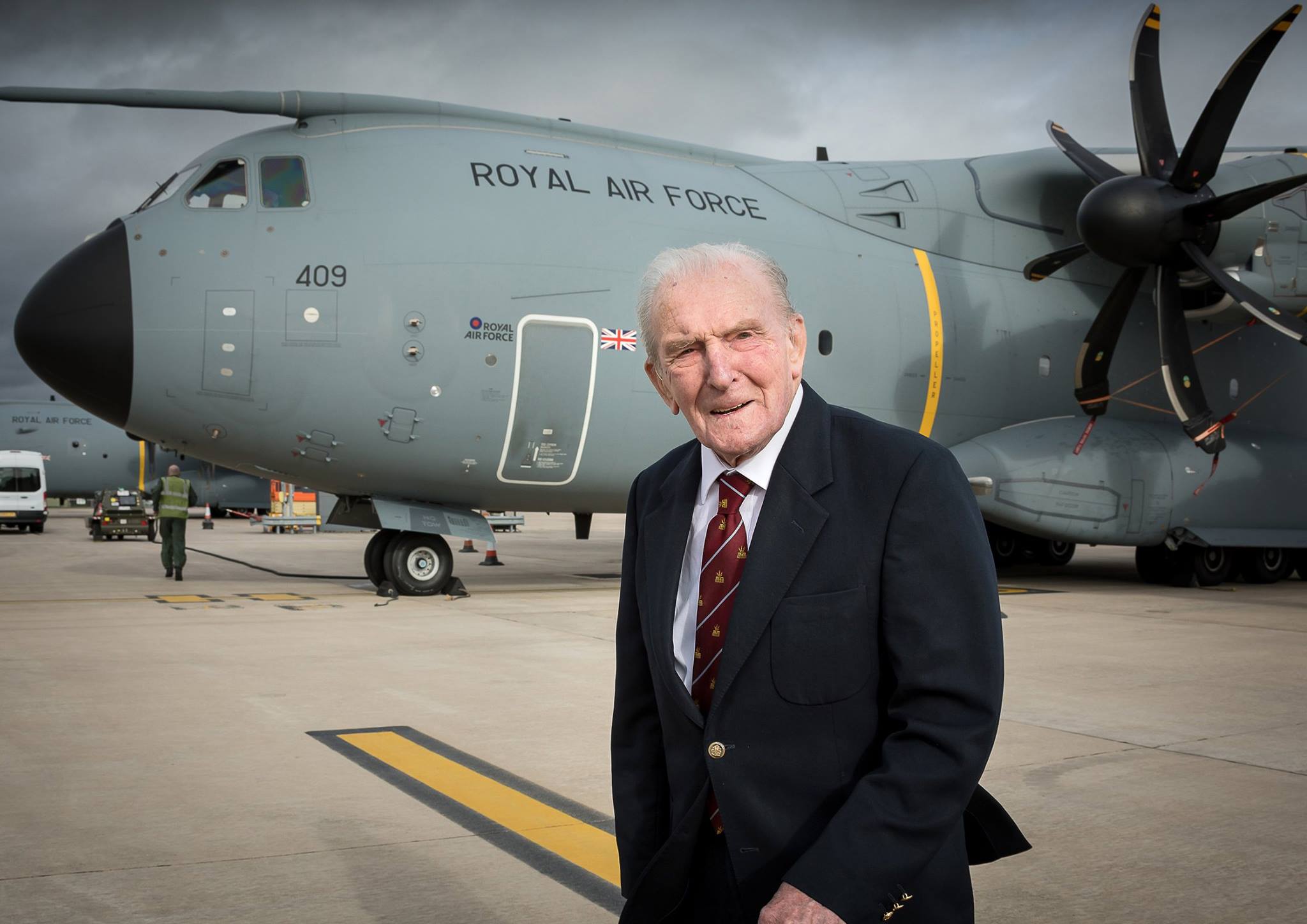 Johnny stands outside a carrier aircraft.