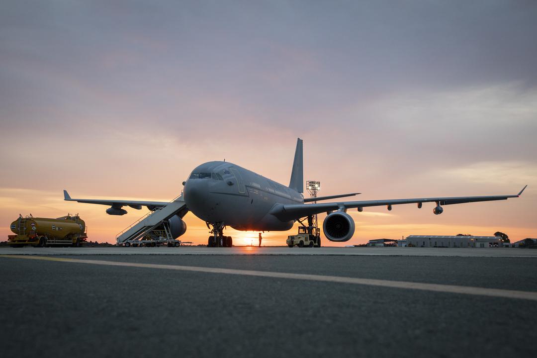 RAF Voyager aircraft on the airfield at sunset. 