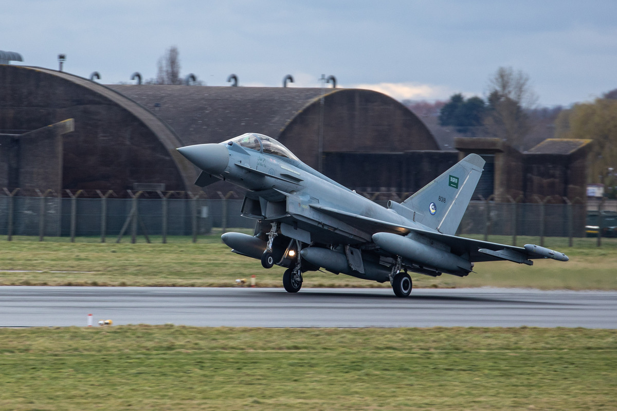 Image shows RAF Typhoon taking off from the airfield.