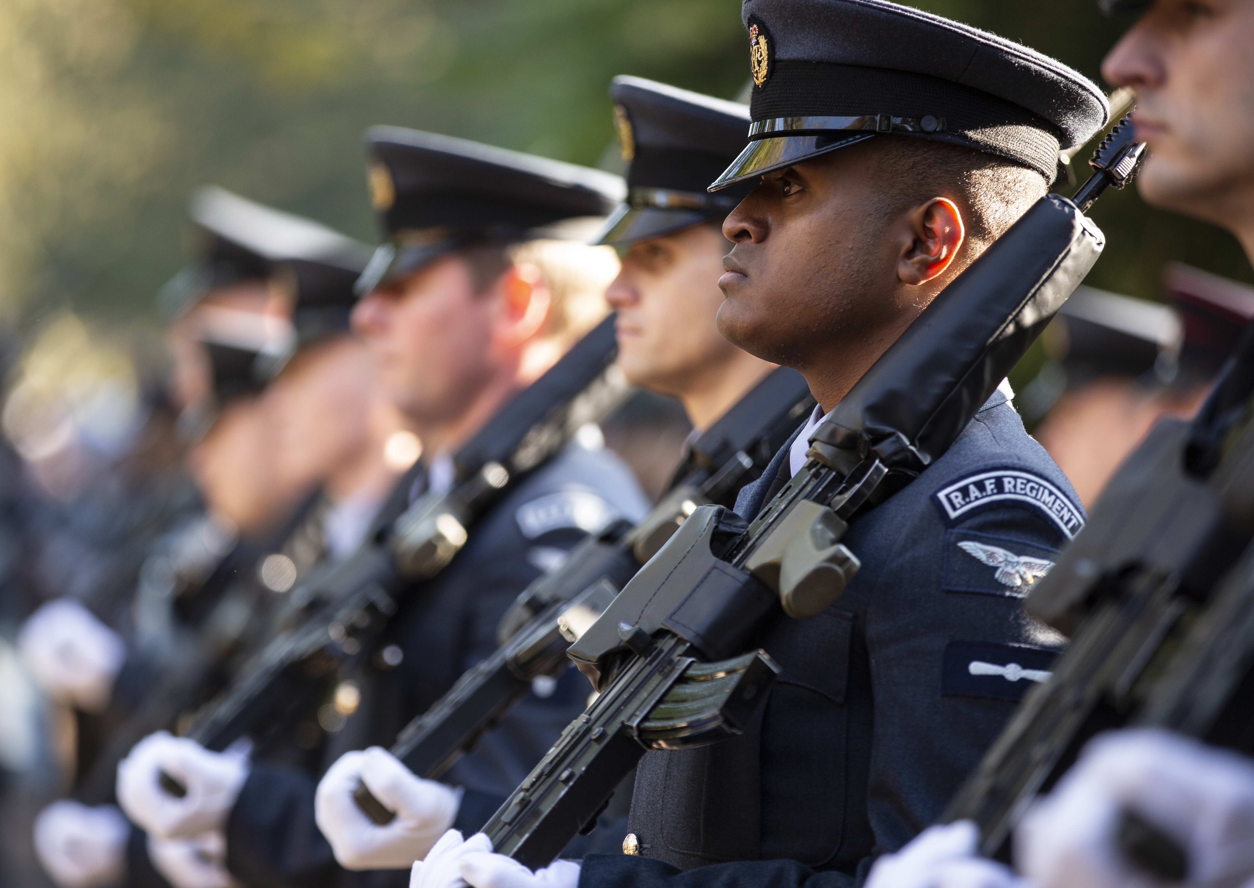 Image shows RAF Regiment holding rifles during parade.