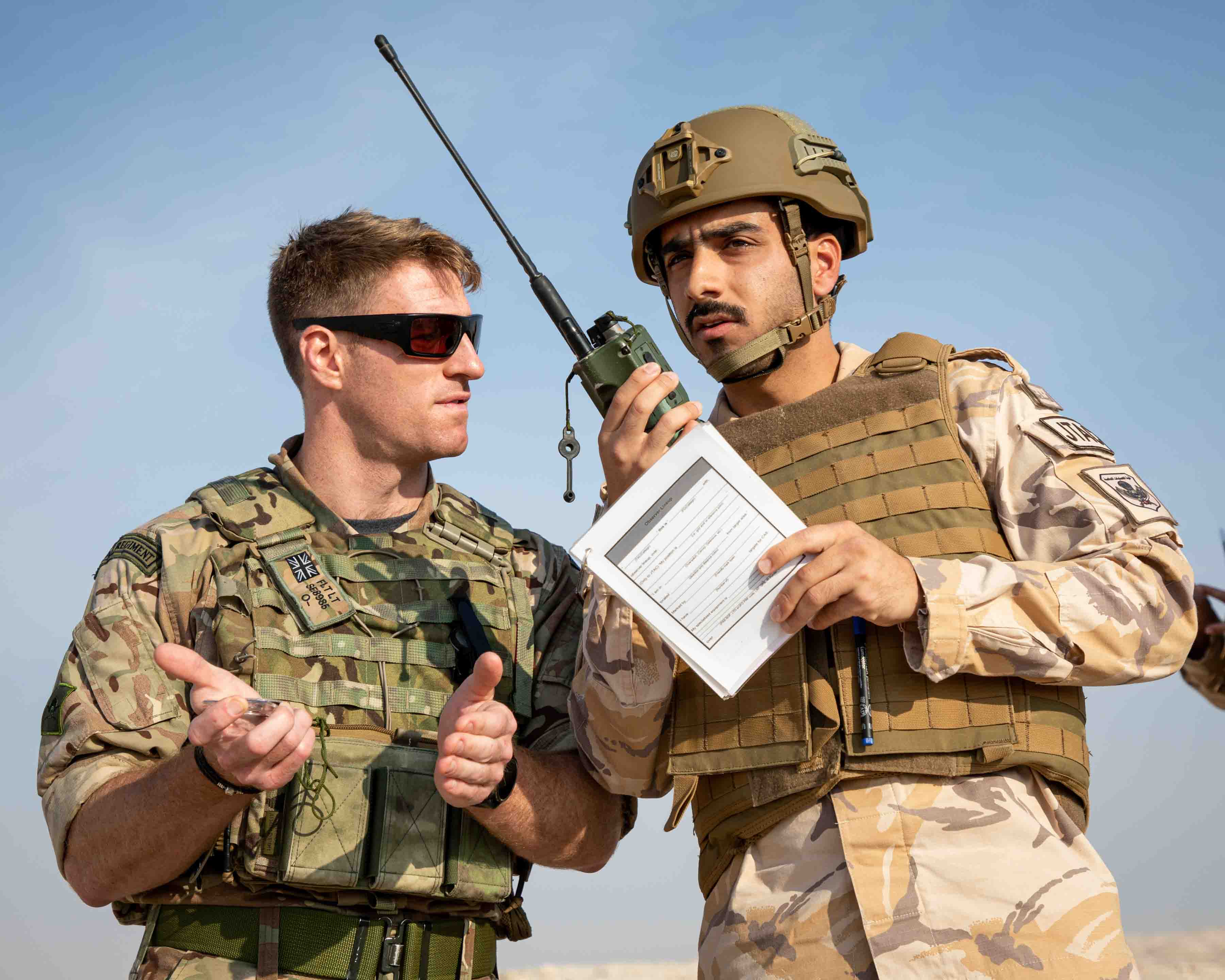 Personnel use radio in Qatar.