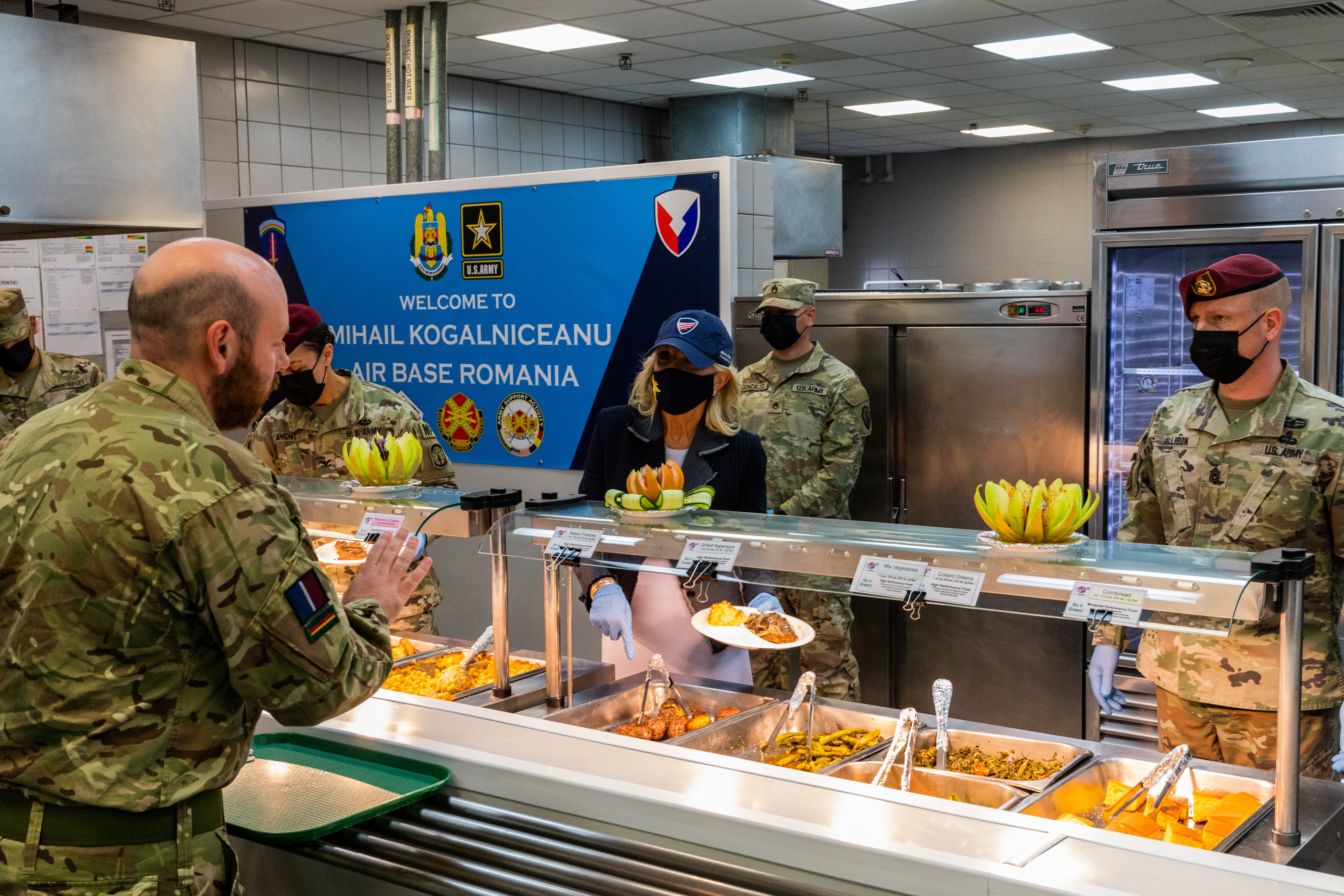 Personnel and First Lady in canteen.