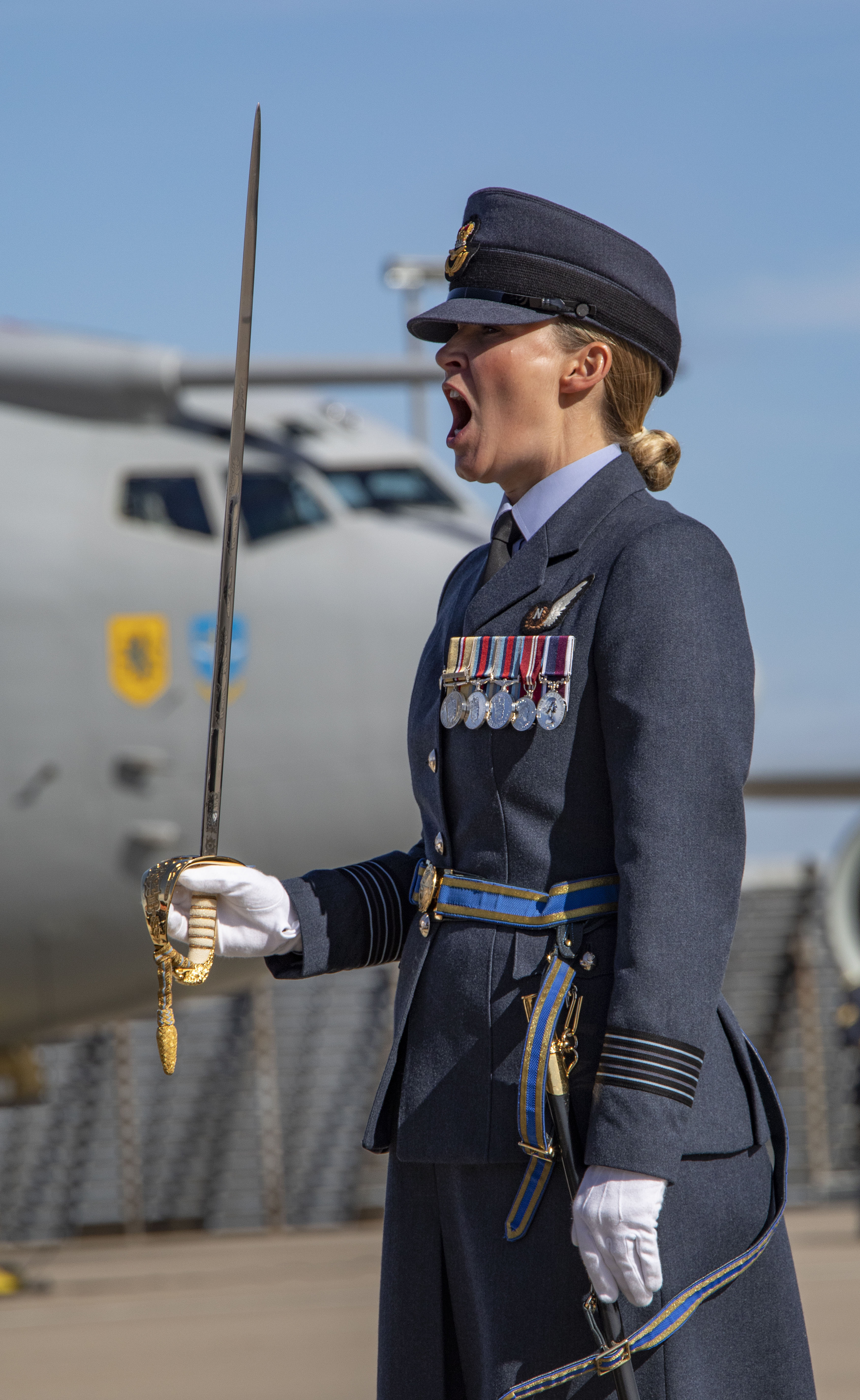 Wing Commander Williams reviewing with sword.