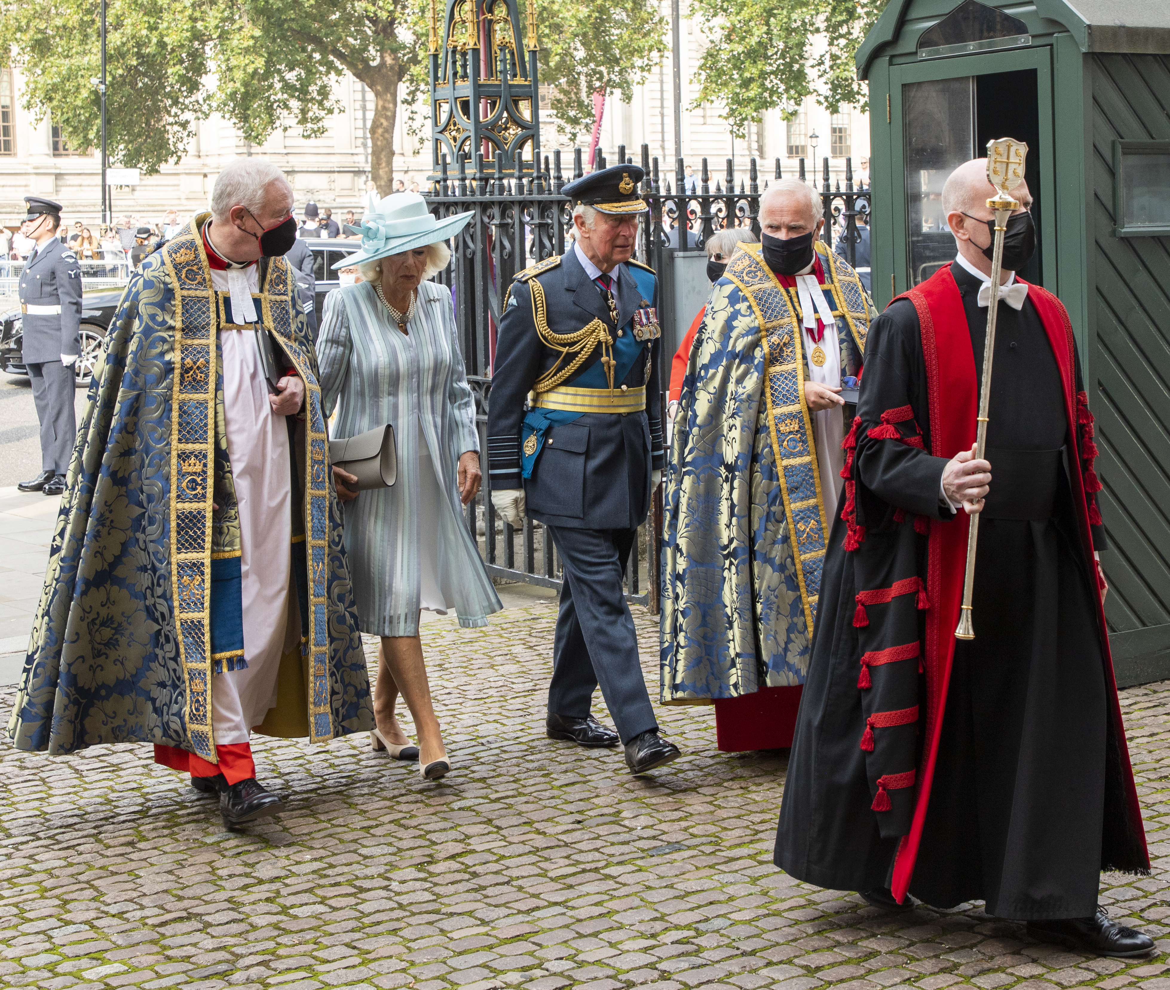 Their Royal Highnesses walk into Westminster Abbey with The Duke and Very Reverends. 