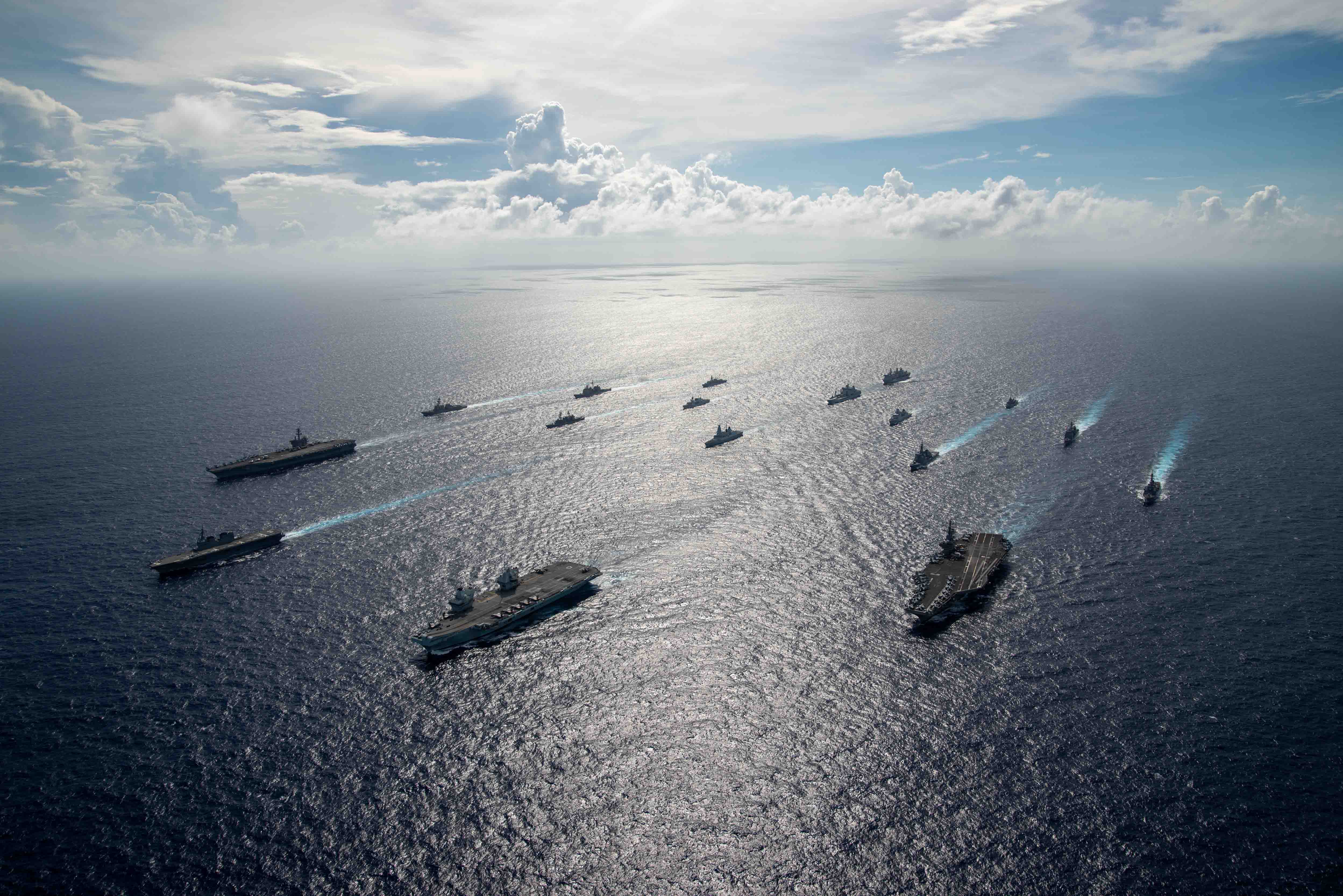 Aircraft carriers in the ocean.