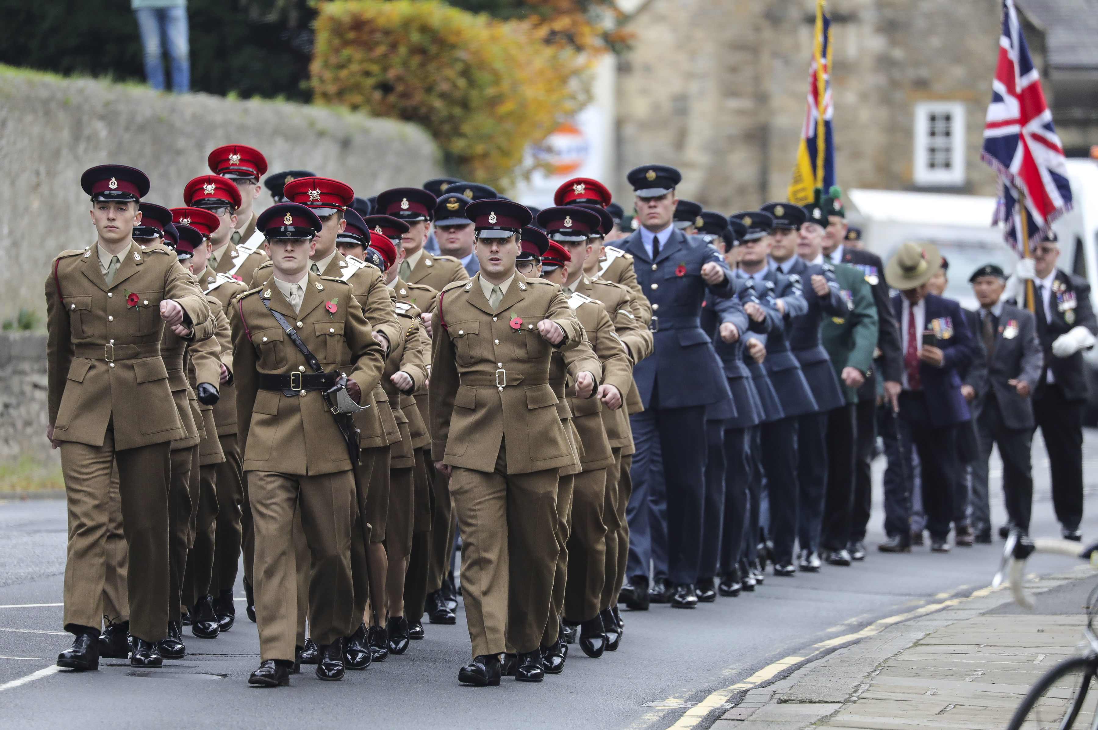 34 Squadron RAF Regiment join members of the Army during parade through the street.