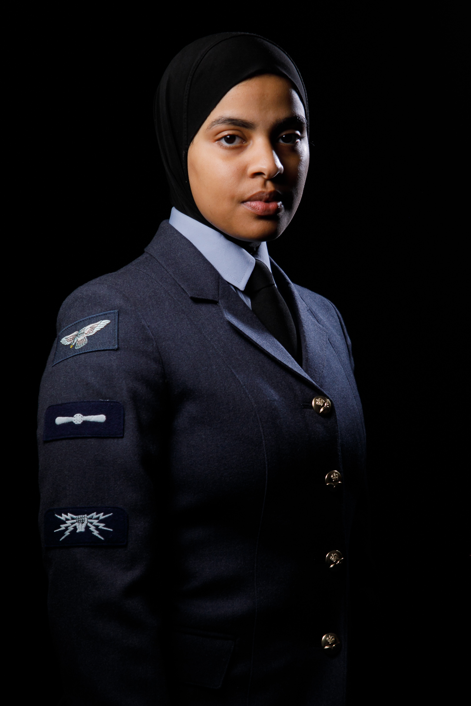 Portrait of Maryam in uniform wearing hijab.