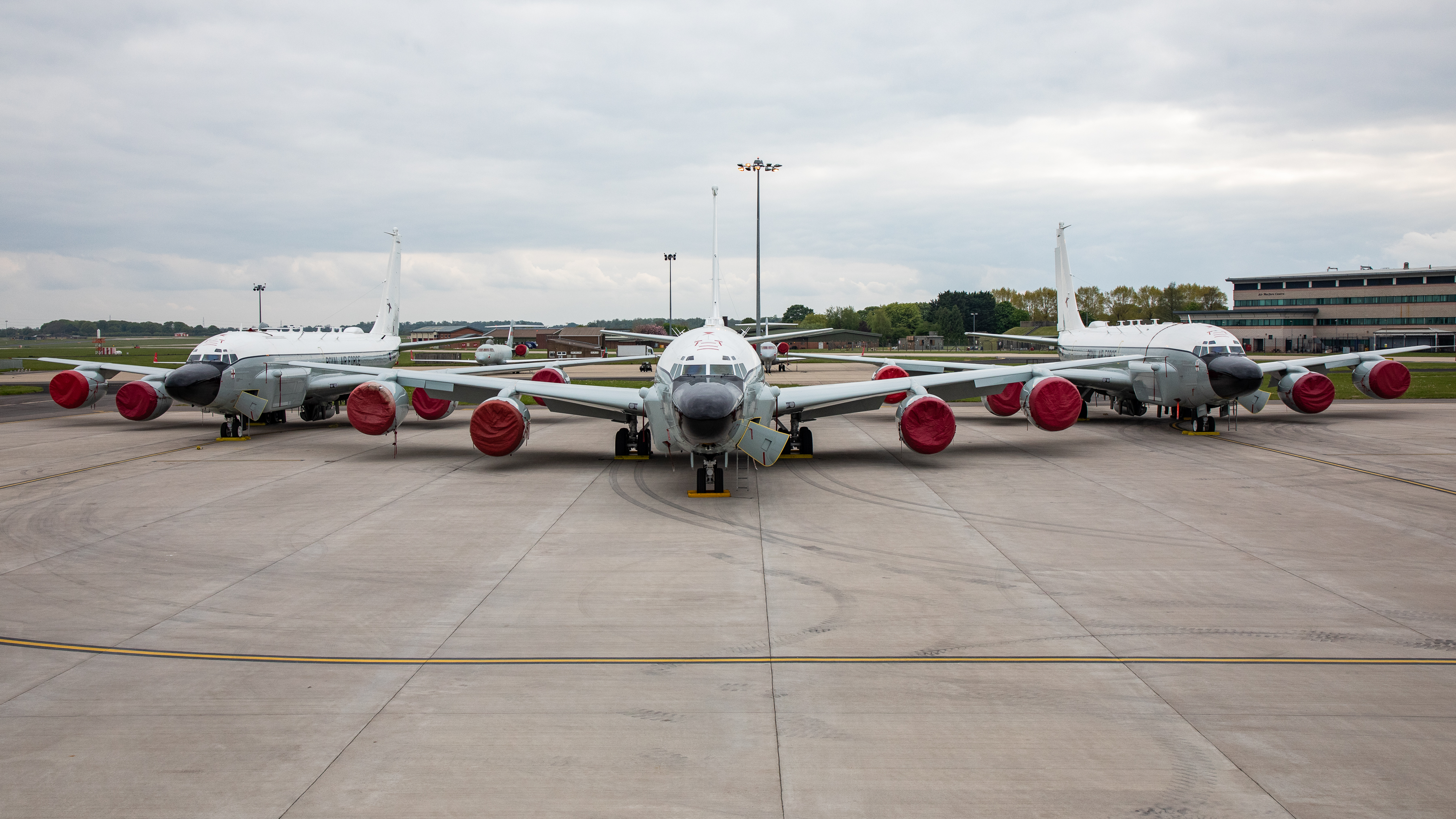 Three Rivet Joint aircraft on the airfield.