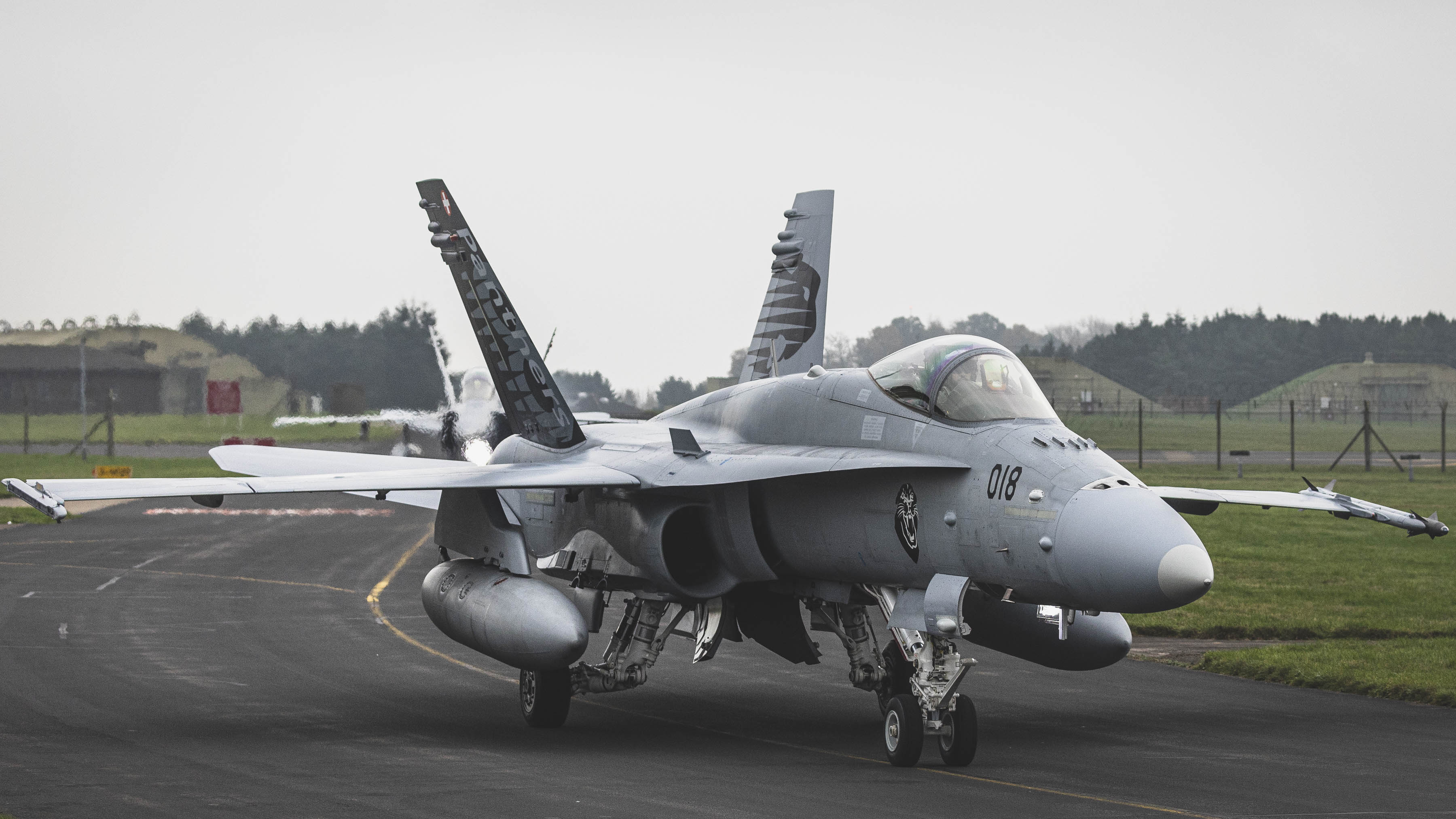 F-18 Hornet aircraft on the airfield.