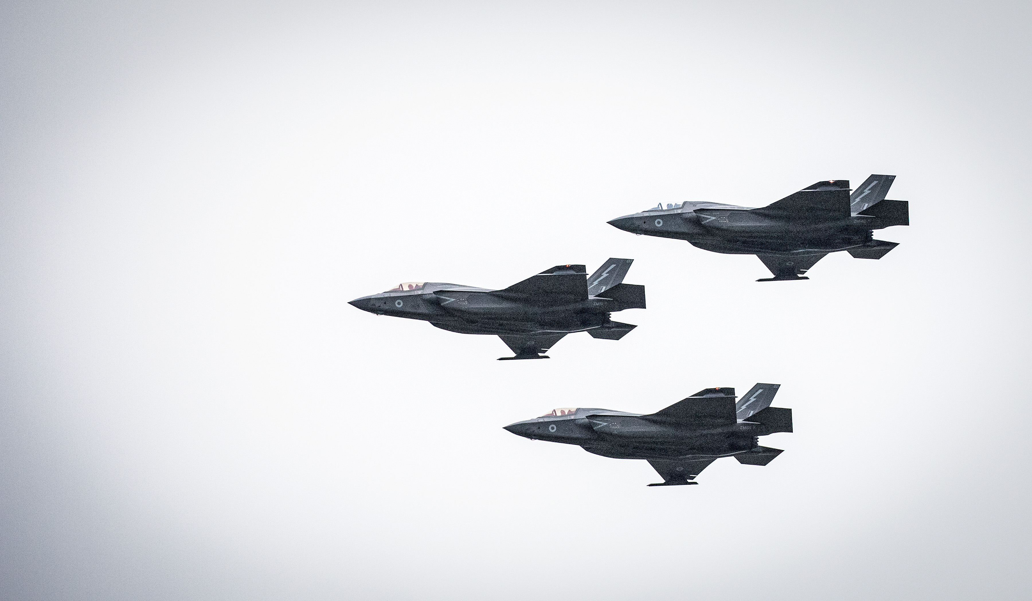 Three Lightnings fly in formation.