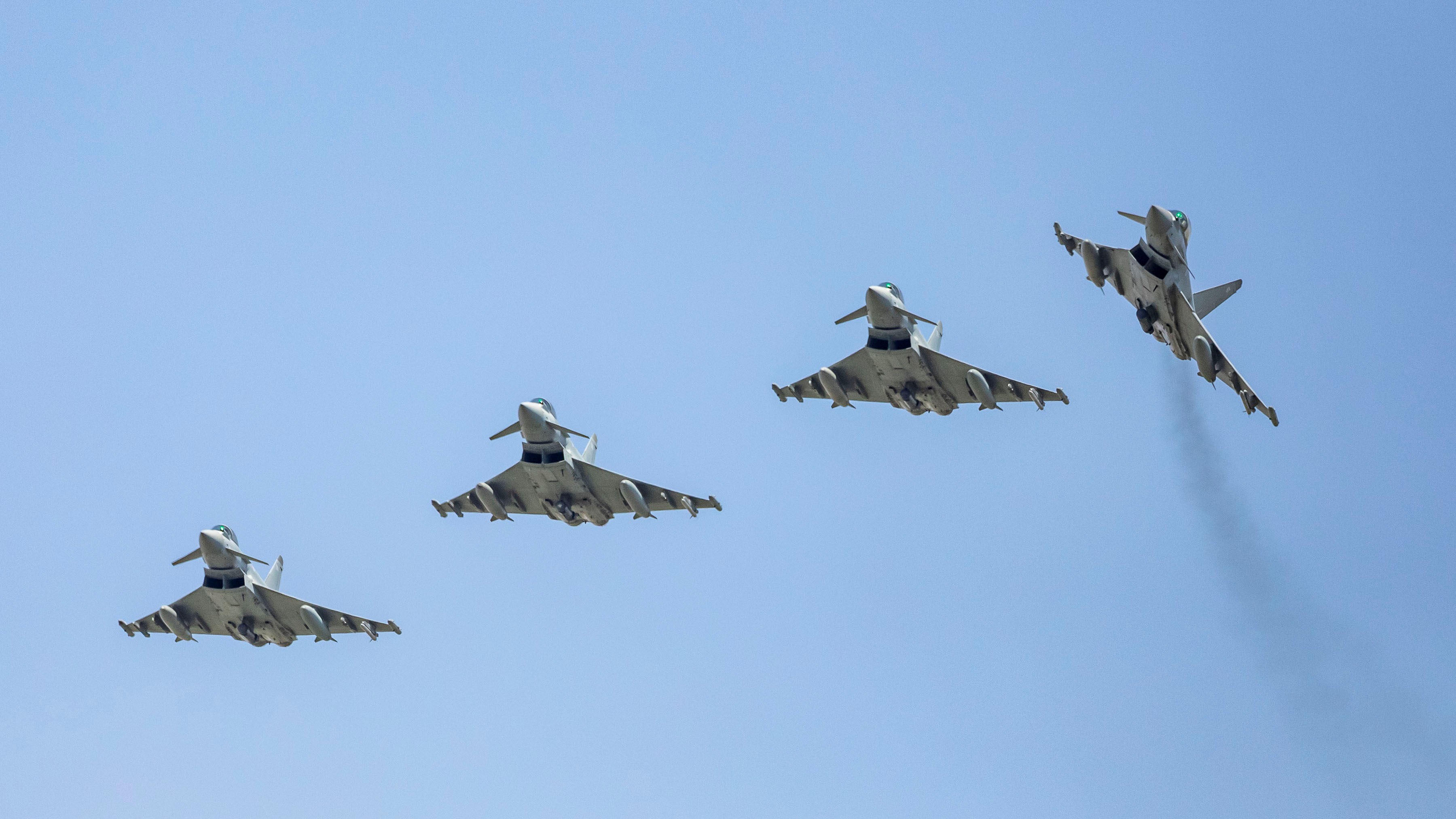 Image shows four RAF Typhoons flying in formation.