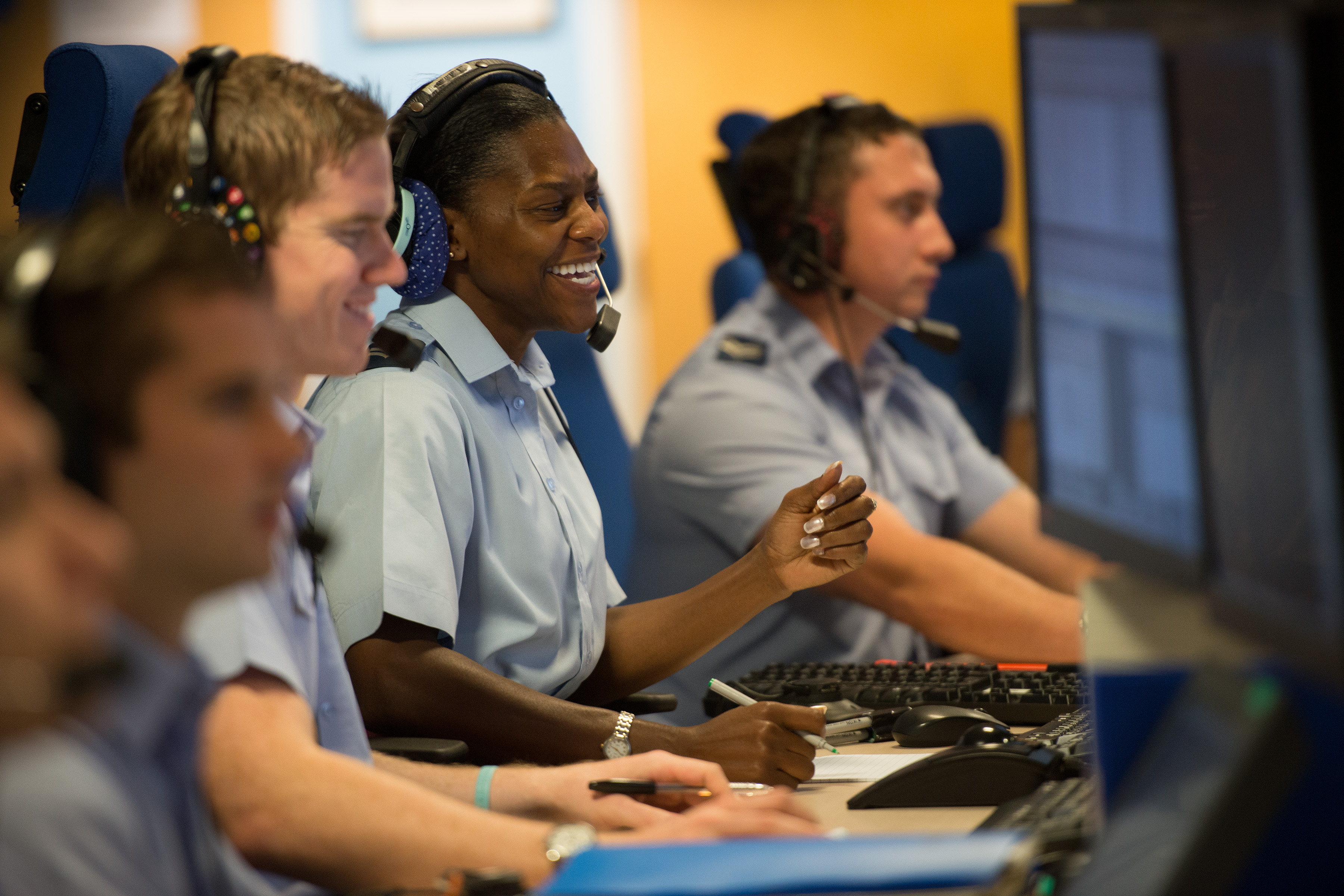 Personnel at computers.