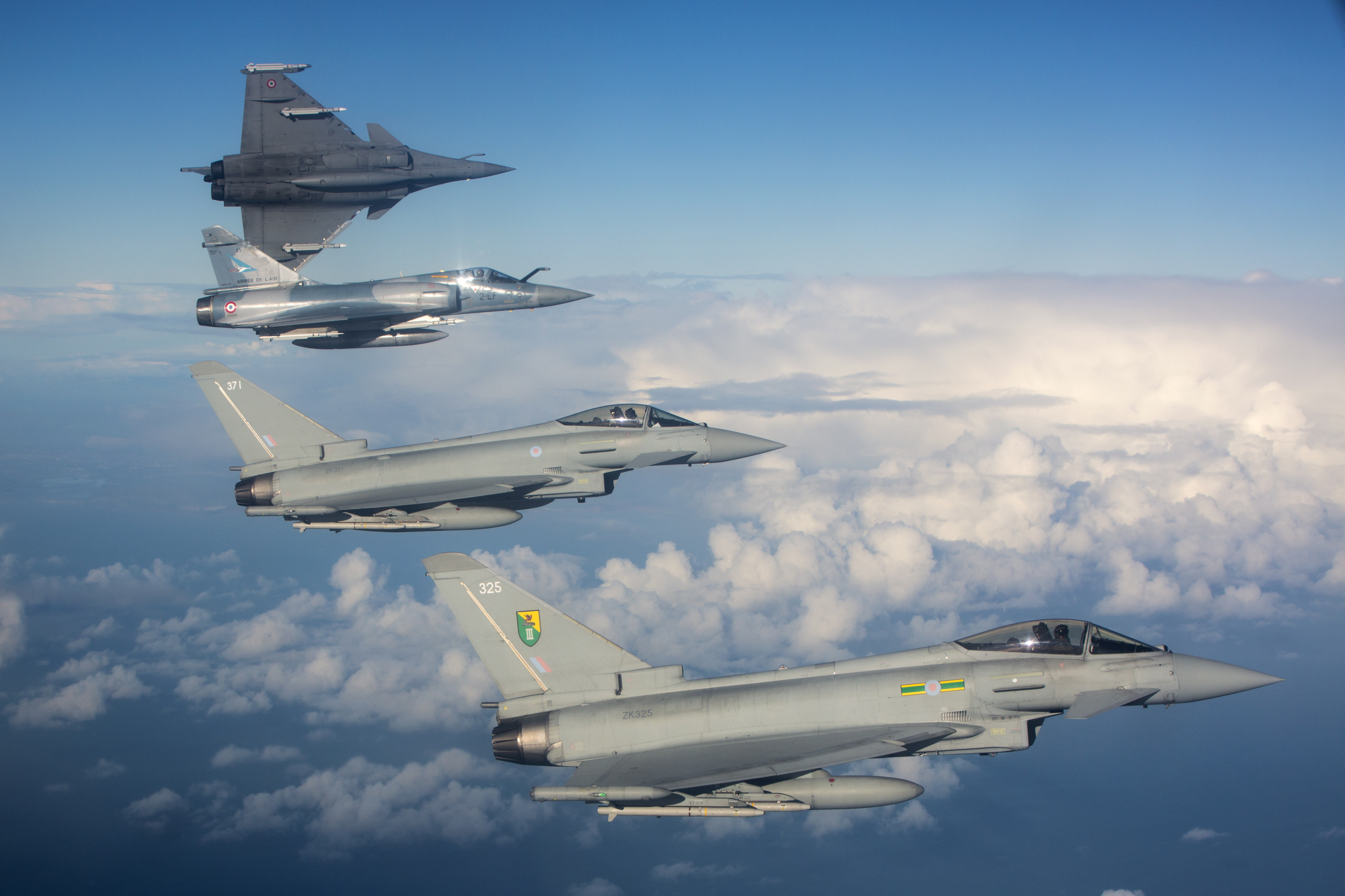 Typhoon and French aircraft in flight.
