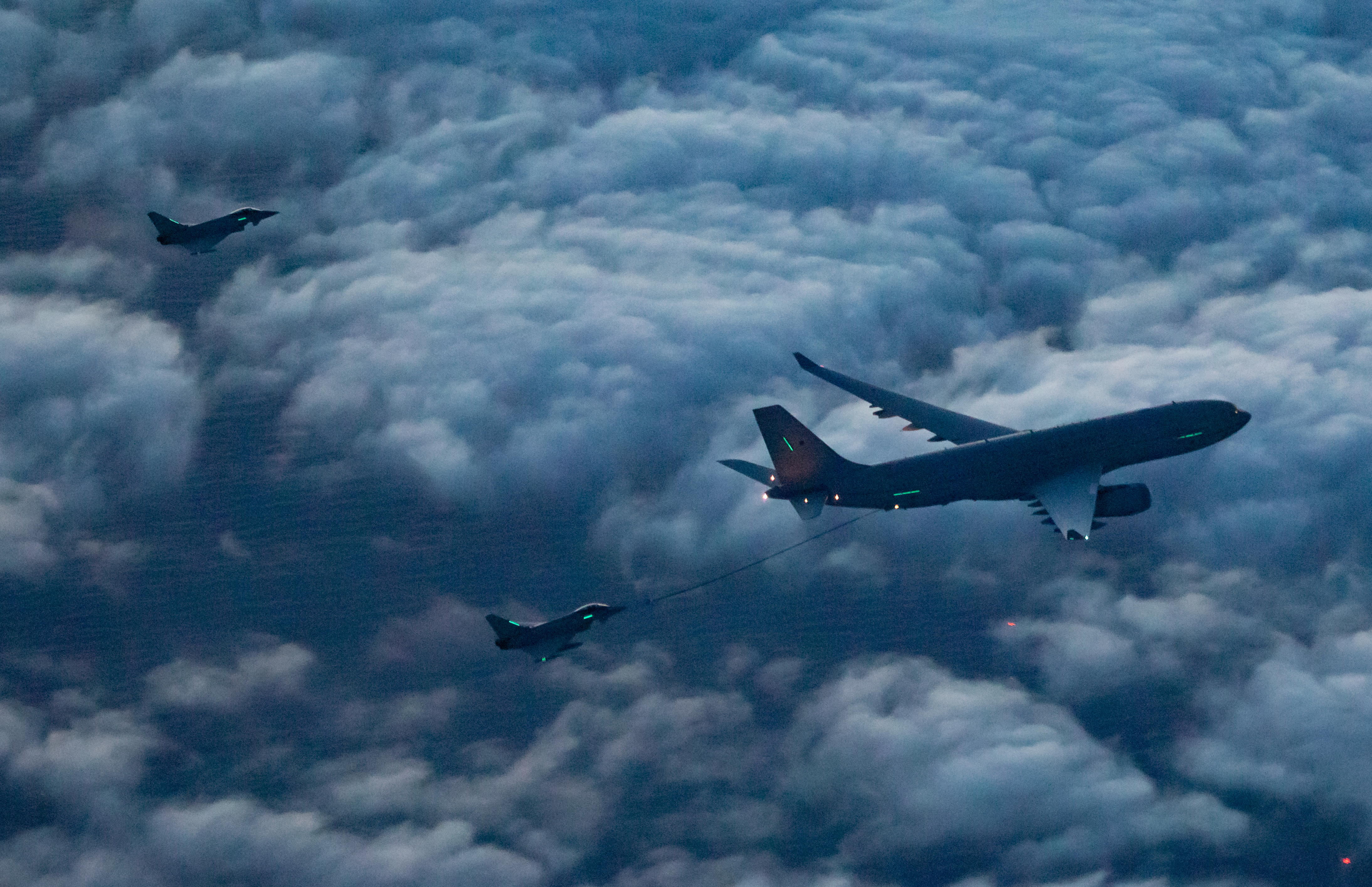 Image shows Typhoon and Voyager aircraft during air-to-air refuelling.