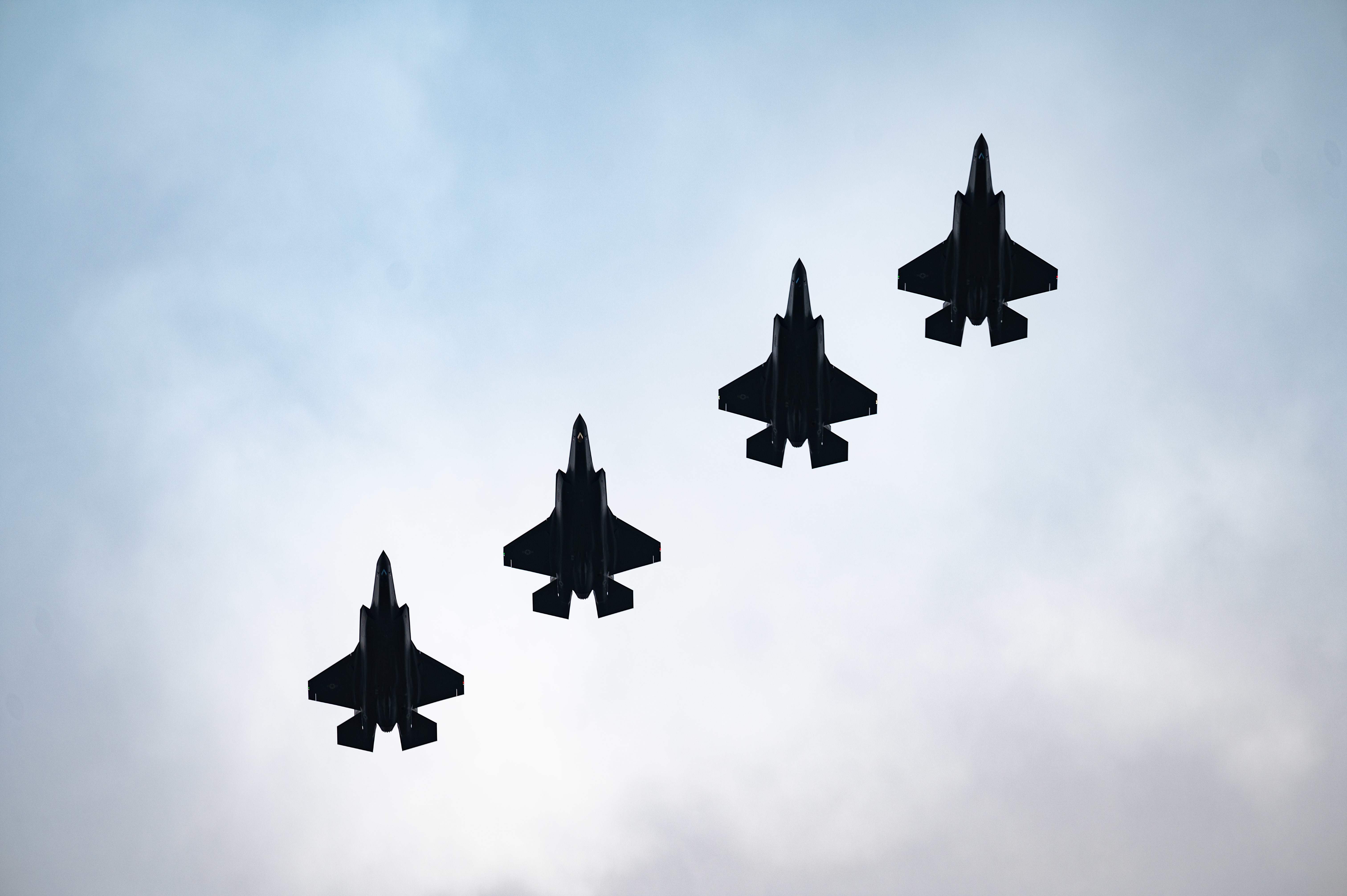 Four F-35 Lightnings flying in formation.
