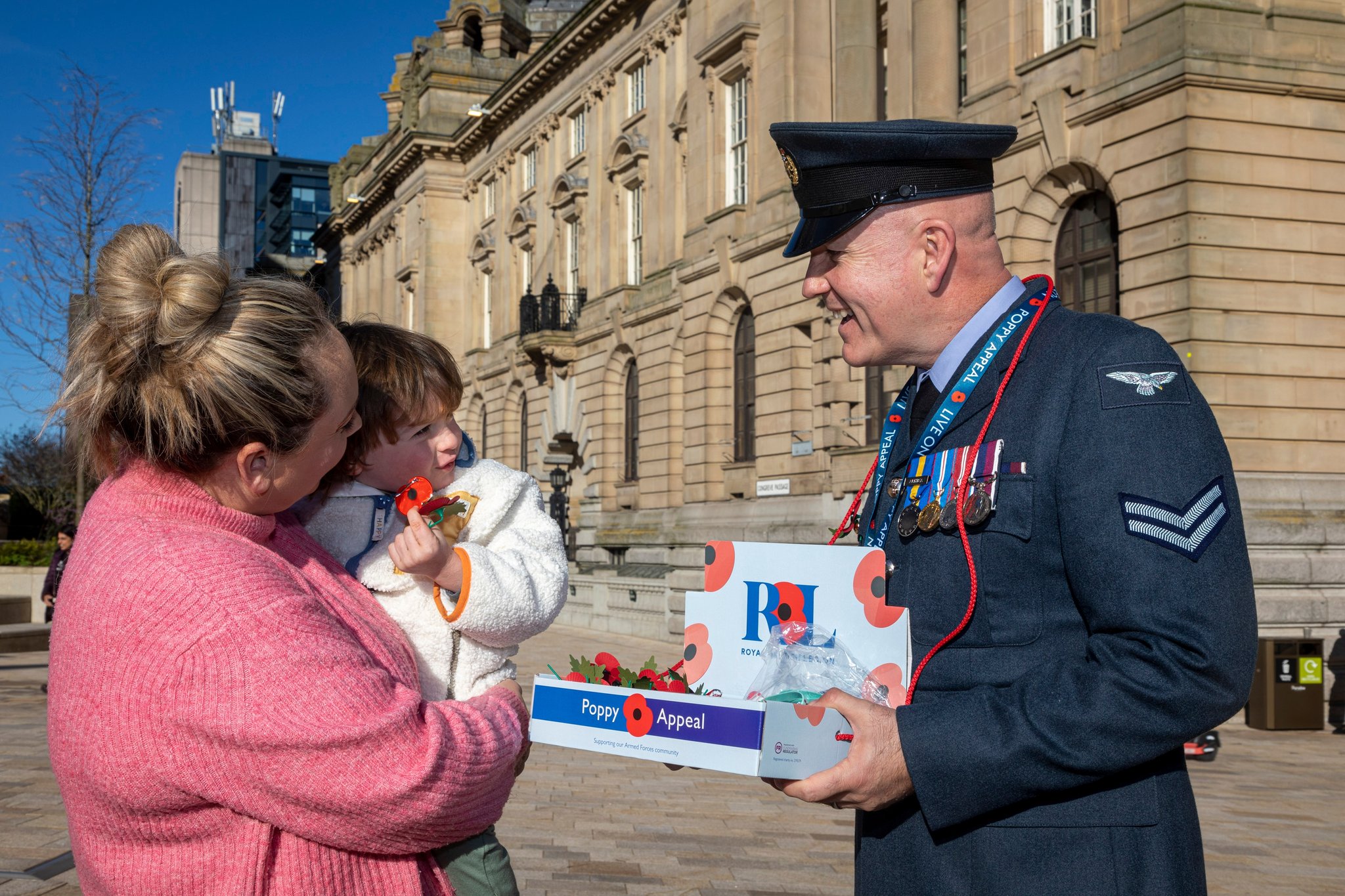 Personnel with Poppy bucket collections, while talking to public. 