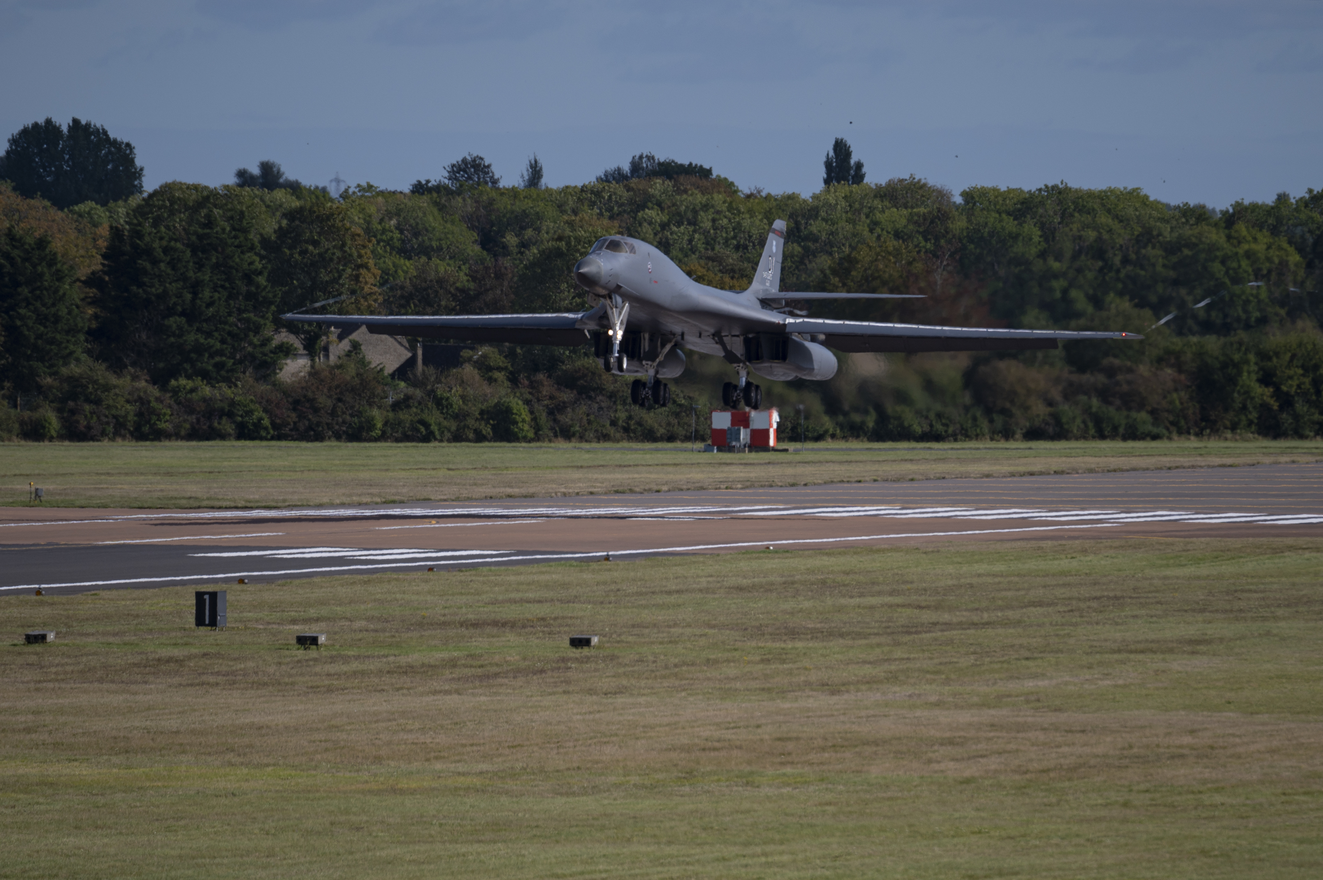 A United States Air Force B-1 Bomber takes off from the runway.