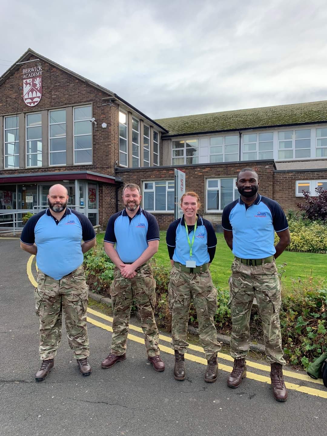 STEM Ambassador's stand outside school.