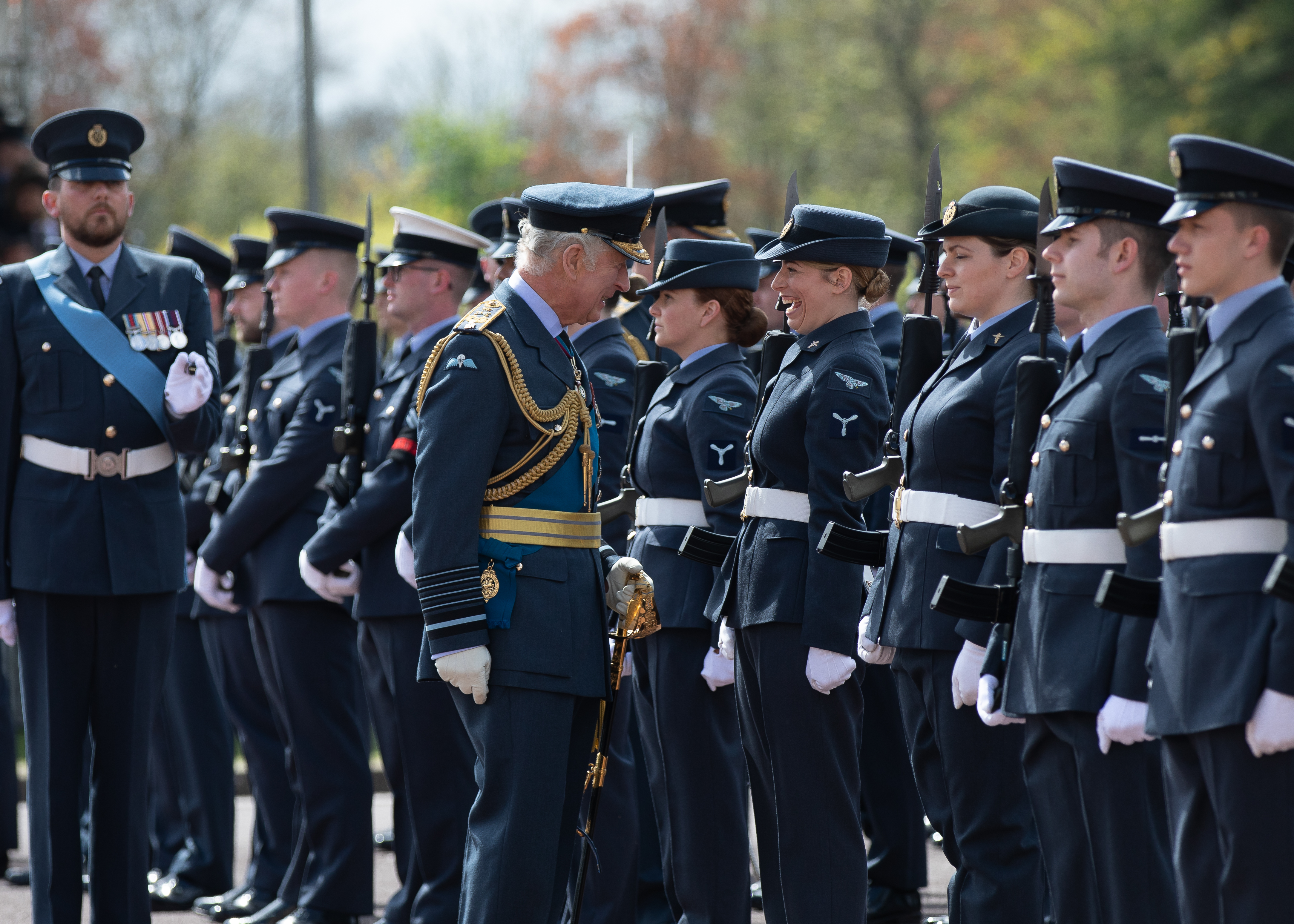 The Prince of Wales talks to personnel during parade.