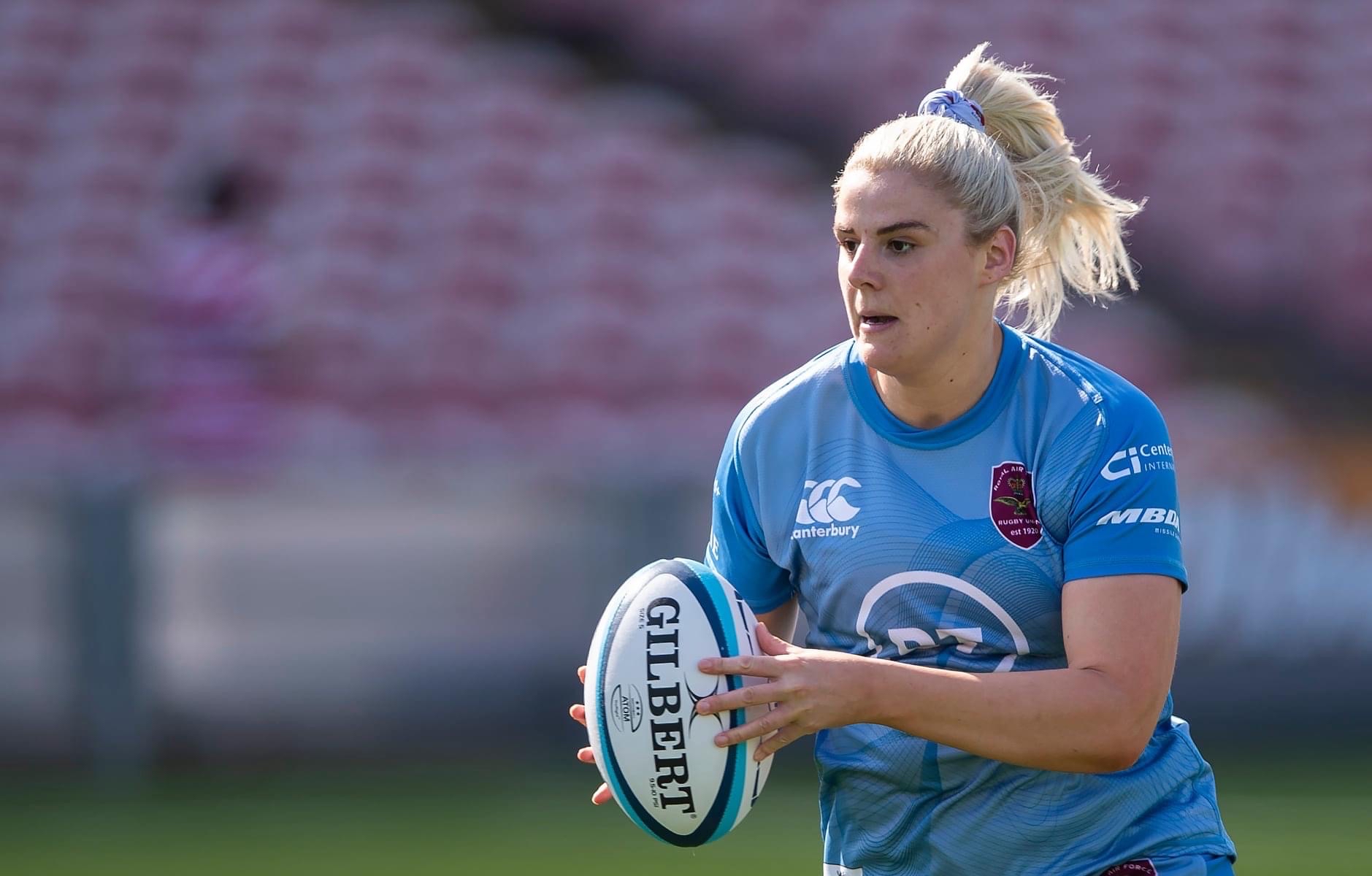 Image shows a female rugby player.