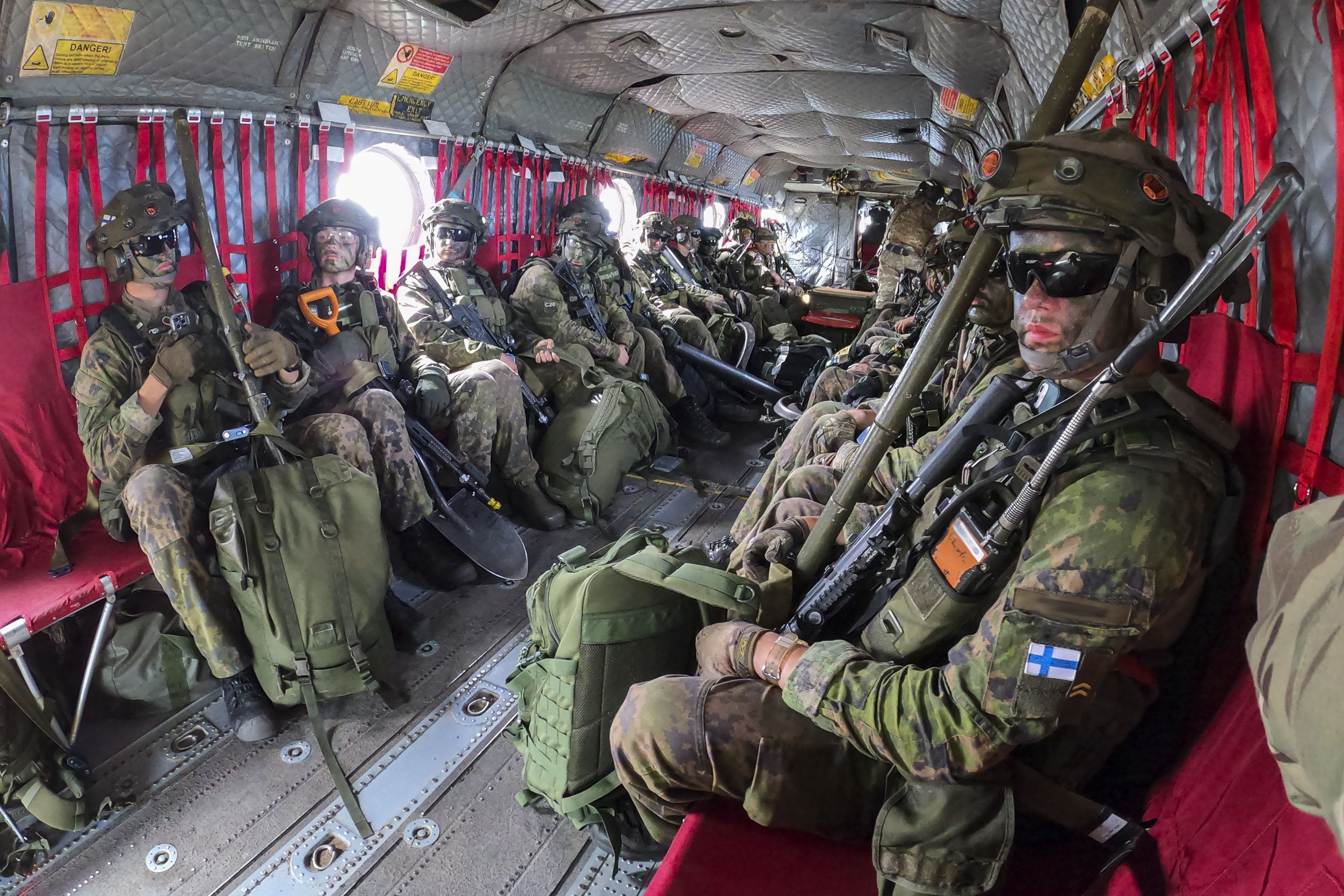 Image shows RAF aviators inside cargo bay of Chinook.