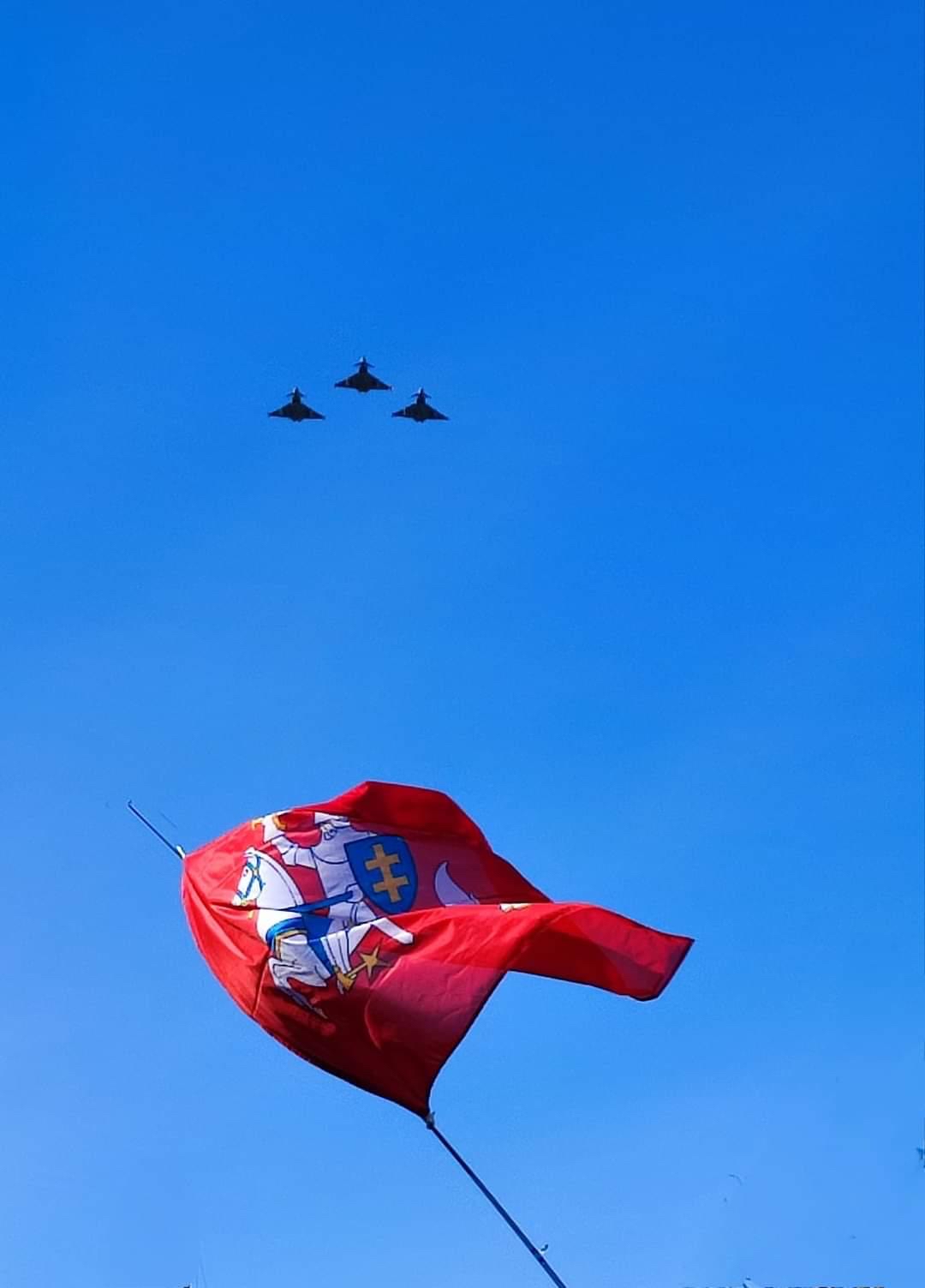 Lithuanian flags below flypast.