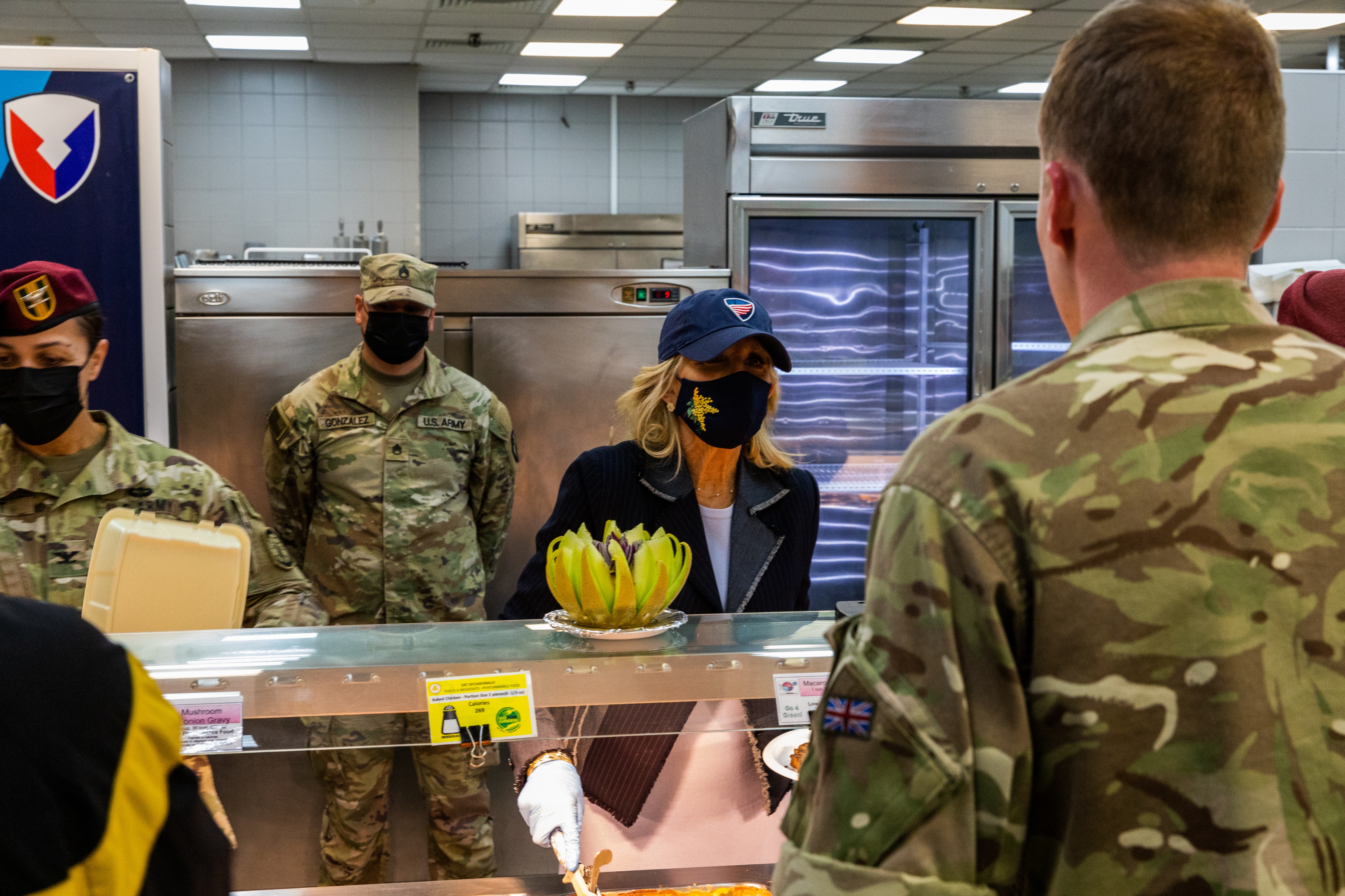 Personnel and First Lady in canteen.